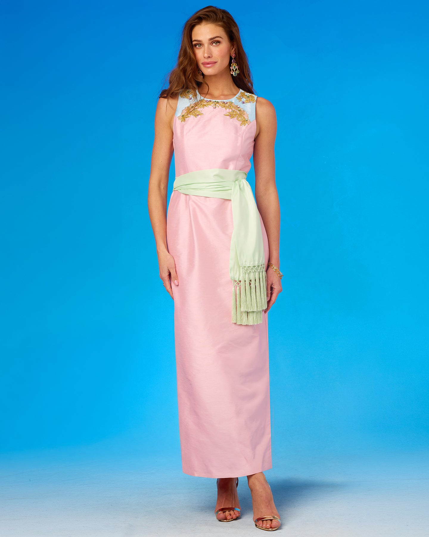 The Margaux Long Sheath Dress in Blush Pink With Blue Accent and Embellishment worn with a mint julep sash belt