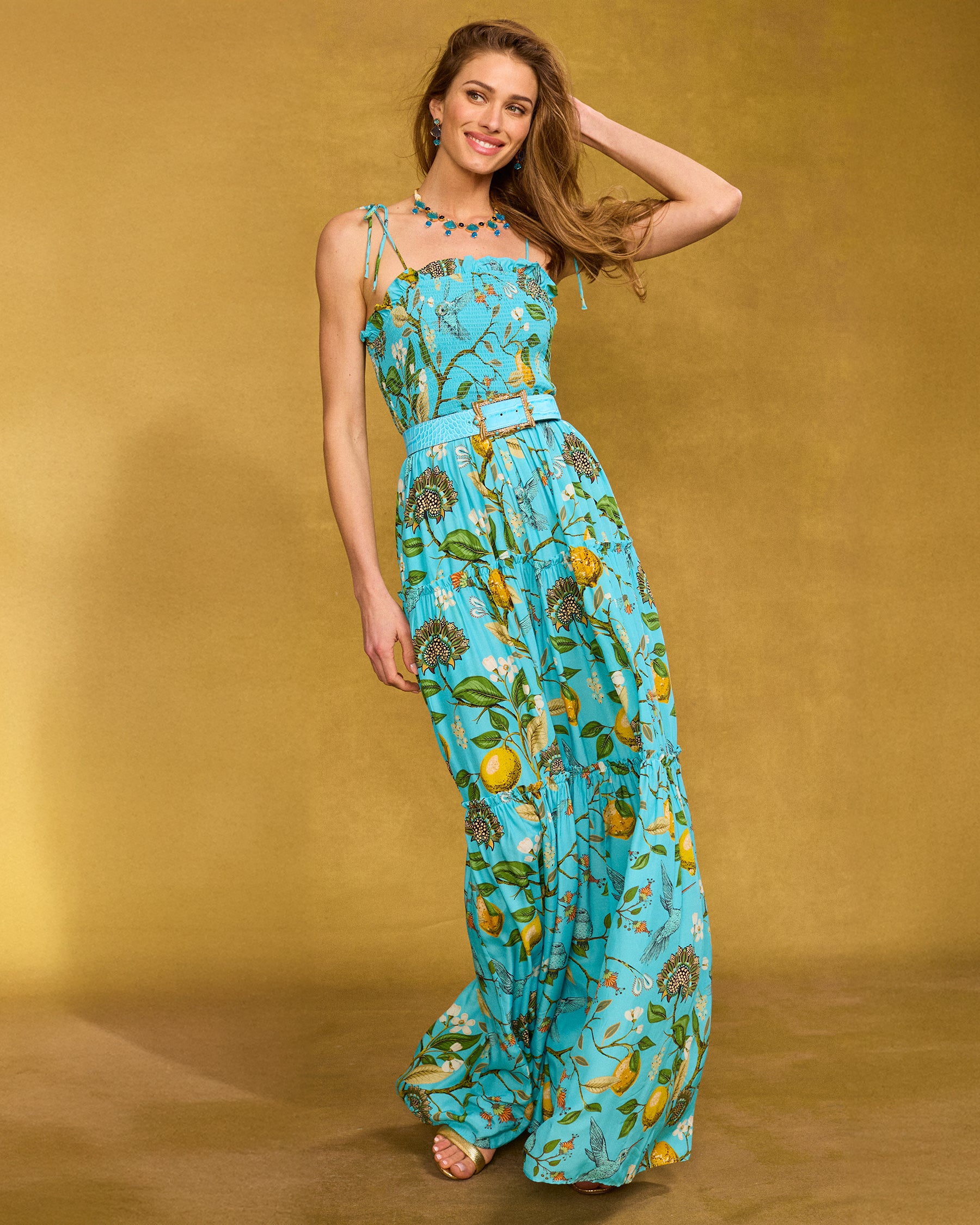 Annabelle Maxi Dress in Flora Turquoise Hummingbird Print with arm raised