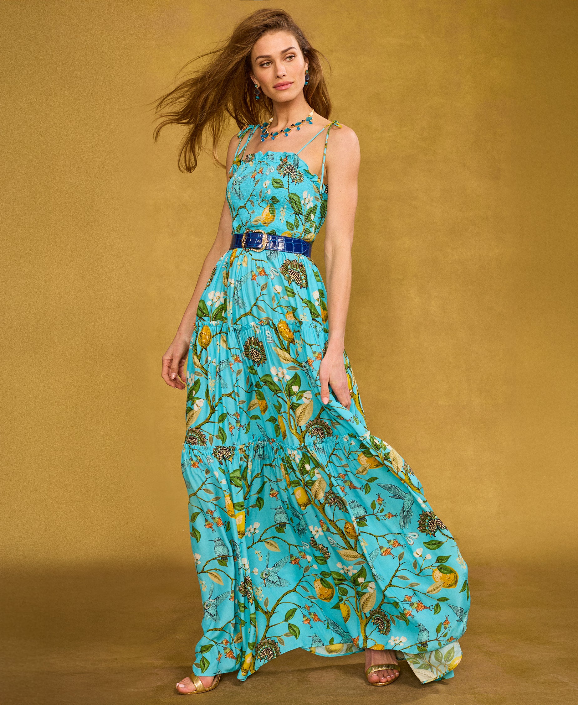 Annabelle Maxi Dress in Flora Turquoise Hummingbird Print walking tot he side