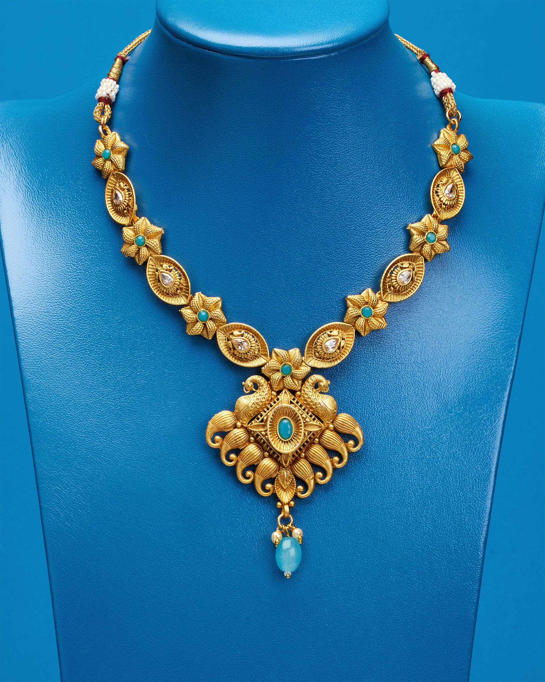 Authentic golden necklace store with Indian blue horns. Limited Edition concept. Unique designs. One-and-only piece.