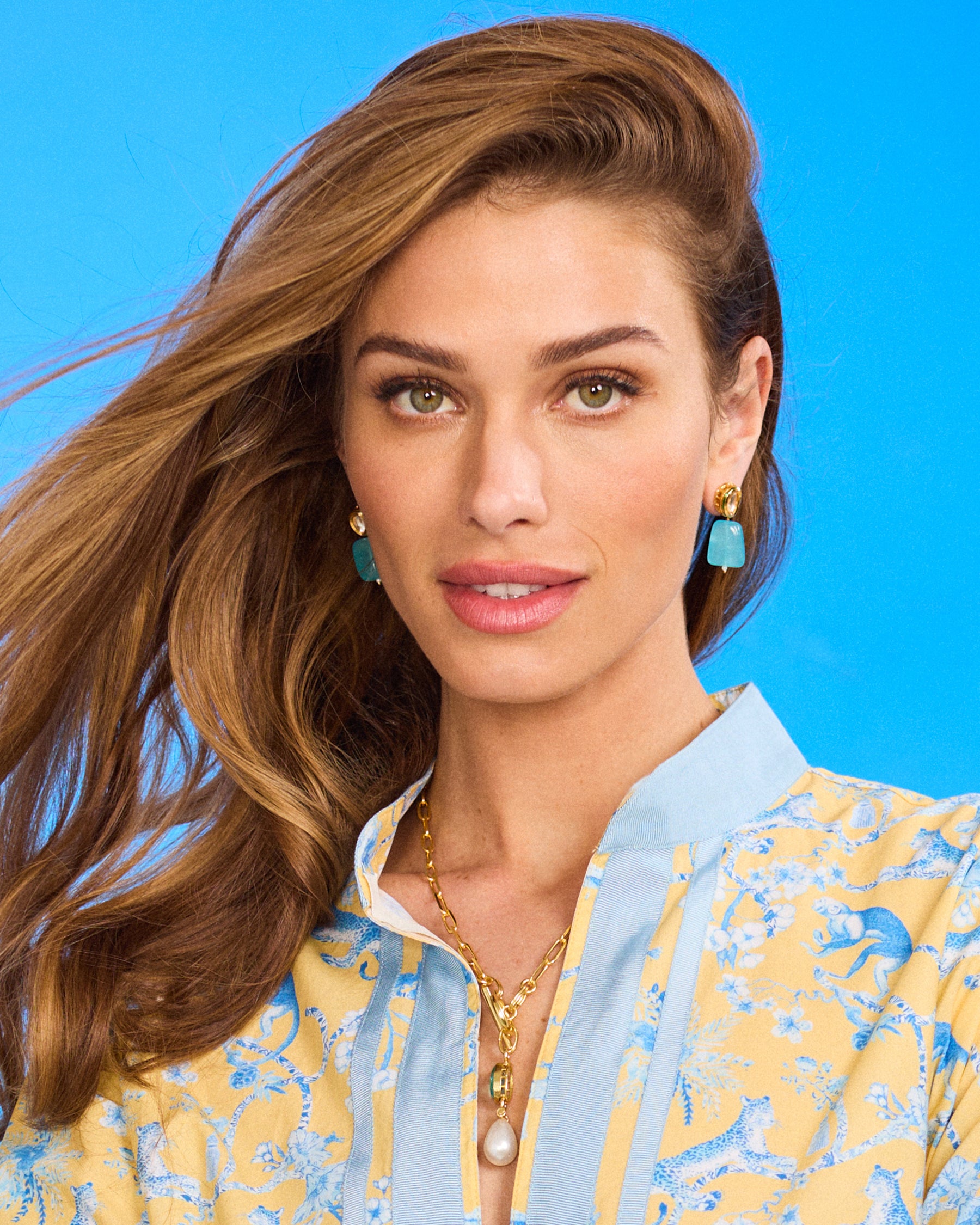 Lucia Earrings in Clear Turquoise Blue worn with the Capri Tunic in Whimsical Jungle Toile Blue and Soft Yellow