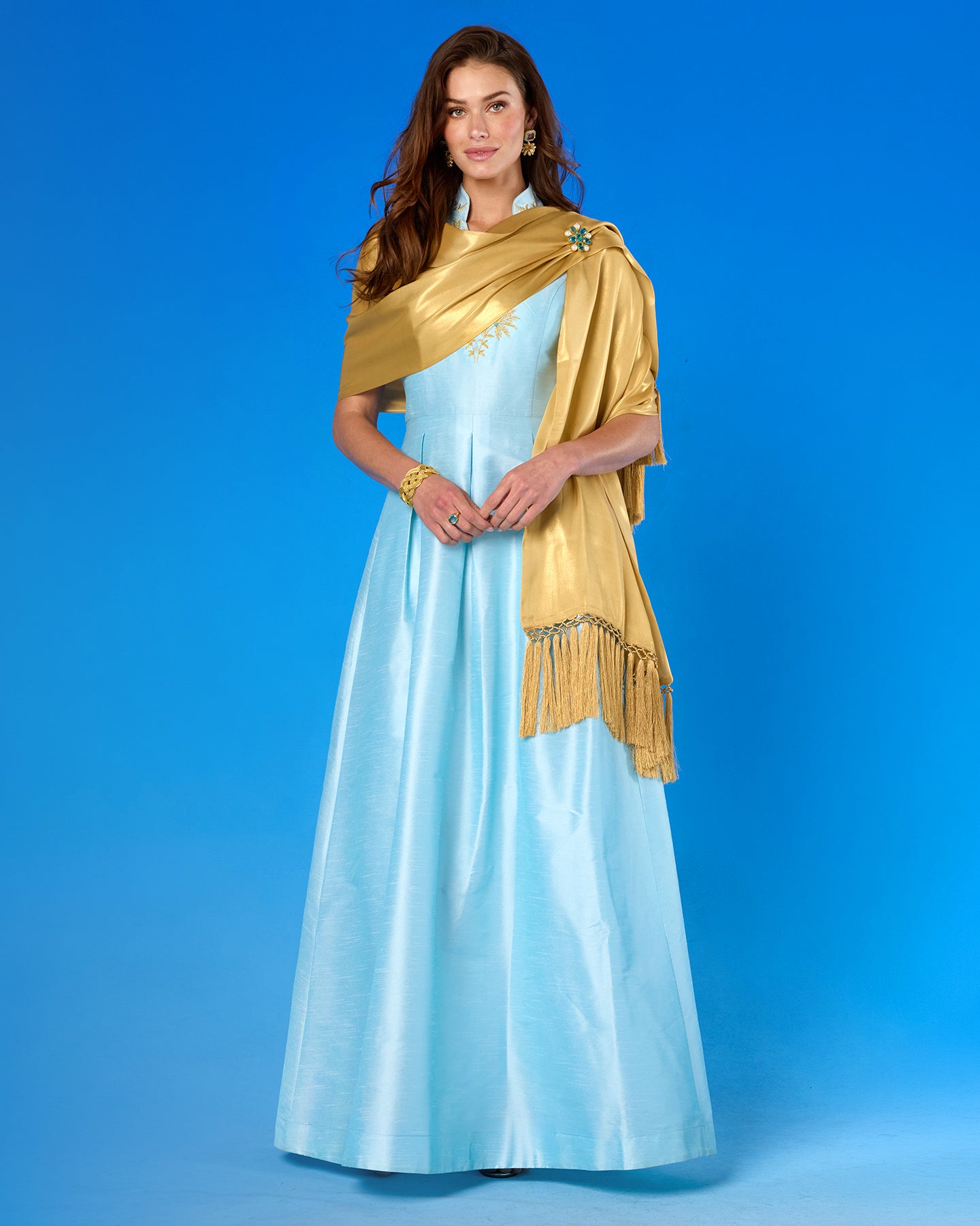 Celestine Gown in Pastel Blue and Gold Palm Embroidery worn with the Arabella Shawl