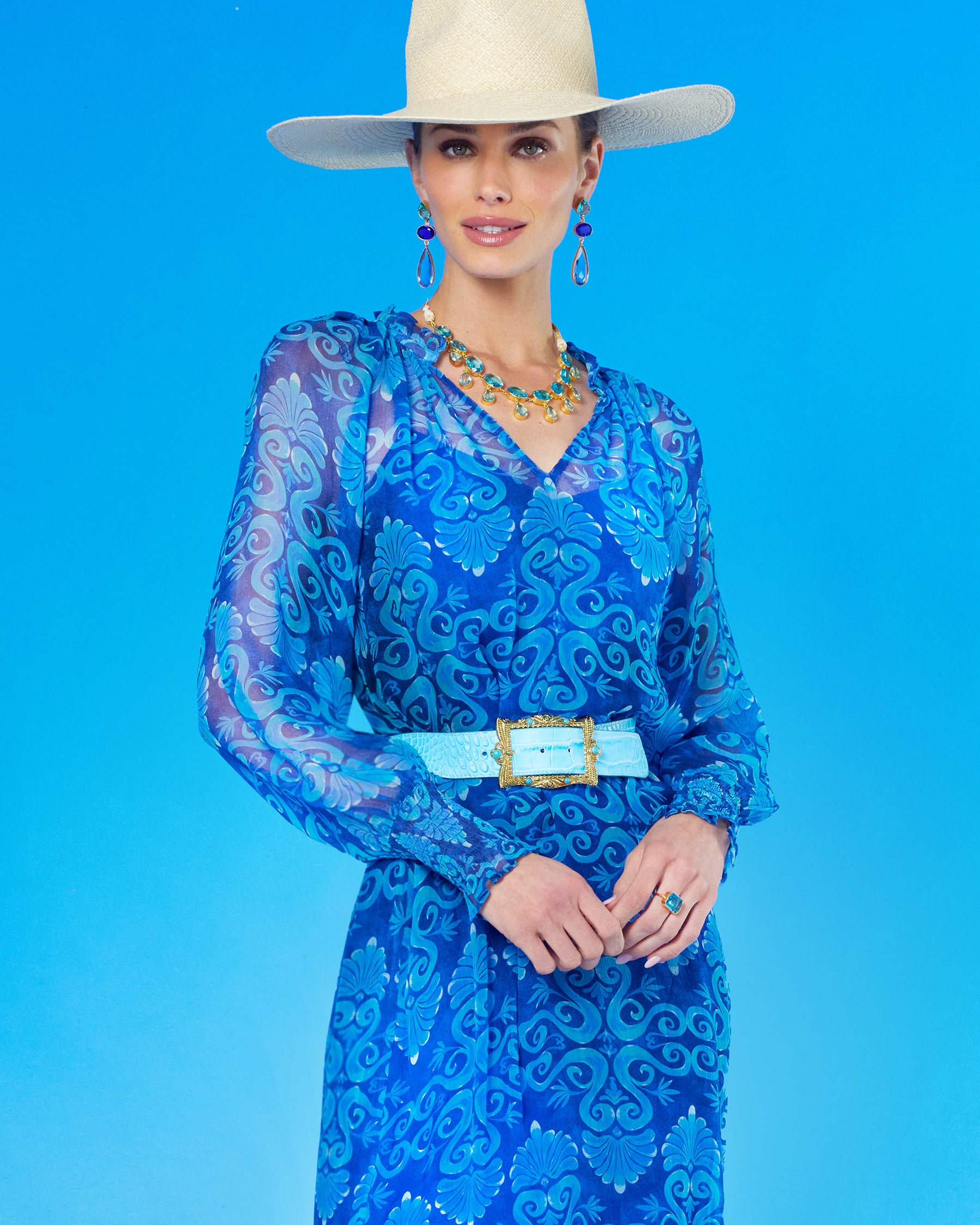 Blair Leather Belt in Croc-Embossed Turquoise worn with the Celine Maxi Crinkle Chiffon Dress in Blue Mediterranean Swirl