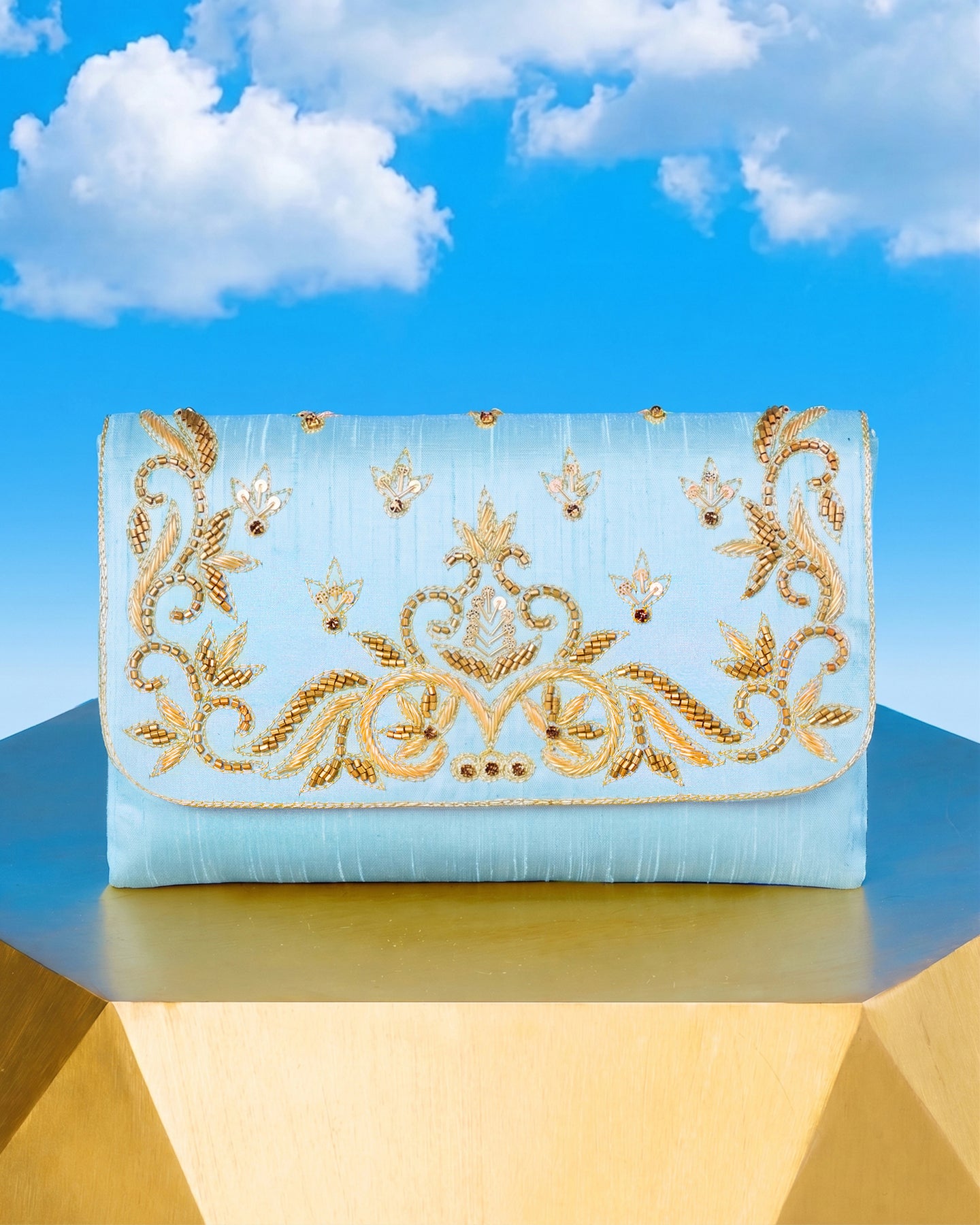 The Corelia Clutch in Pastel Blue and Gold Embellishment front view