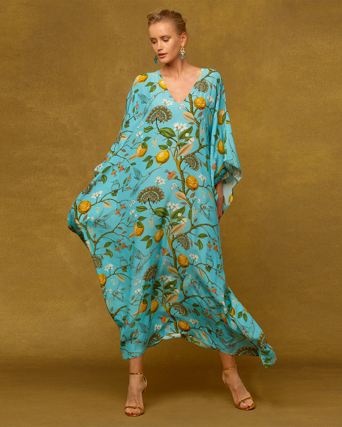 Flora Long Kaftan in Turquoise Hummingbird Print-flowing in the wind