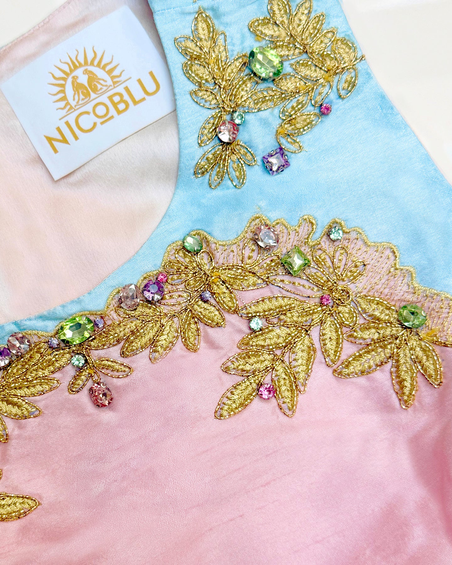 Embellishment detail of the Margaux Long Sheath Dress in Blush Pink With Blue Accent and Embellishment
