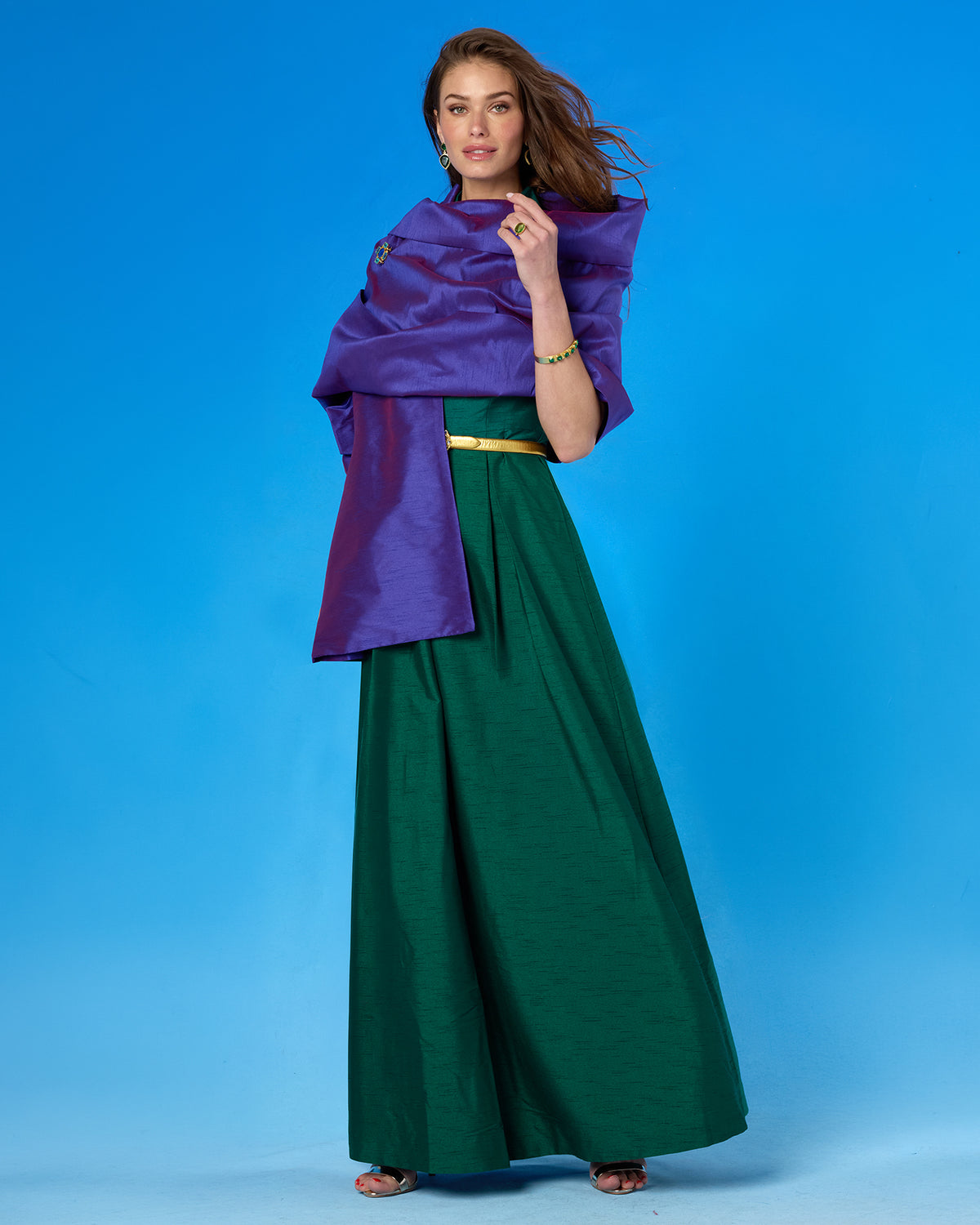 The Valentina Shawl in Orchid Purple worn with the Isabella Cap-Sleeve Gown in Emerald Green