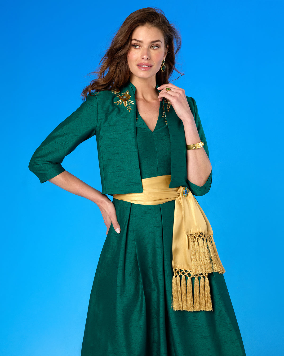 Isabella Cap-Sleeve Gown in Emerald Green worn with the Esmeralda Bolero Jacket in Emerald Green and Gold Floral Embellishment