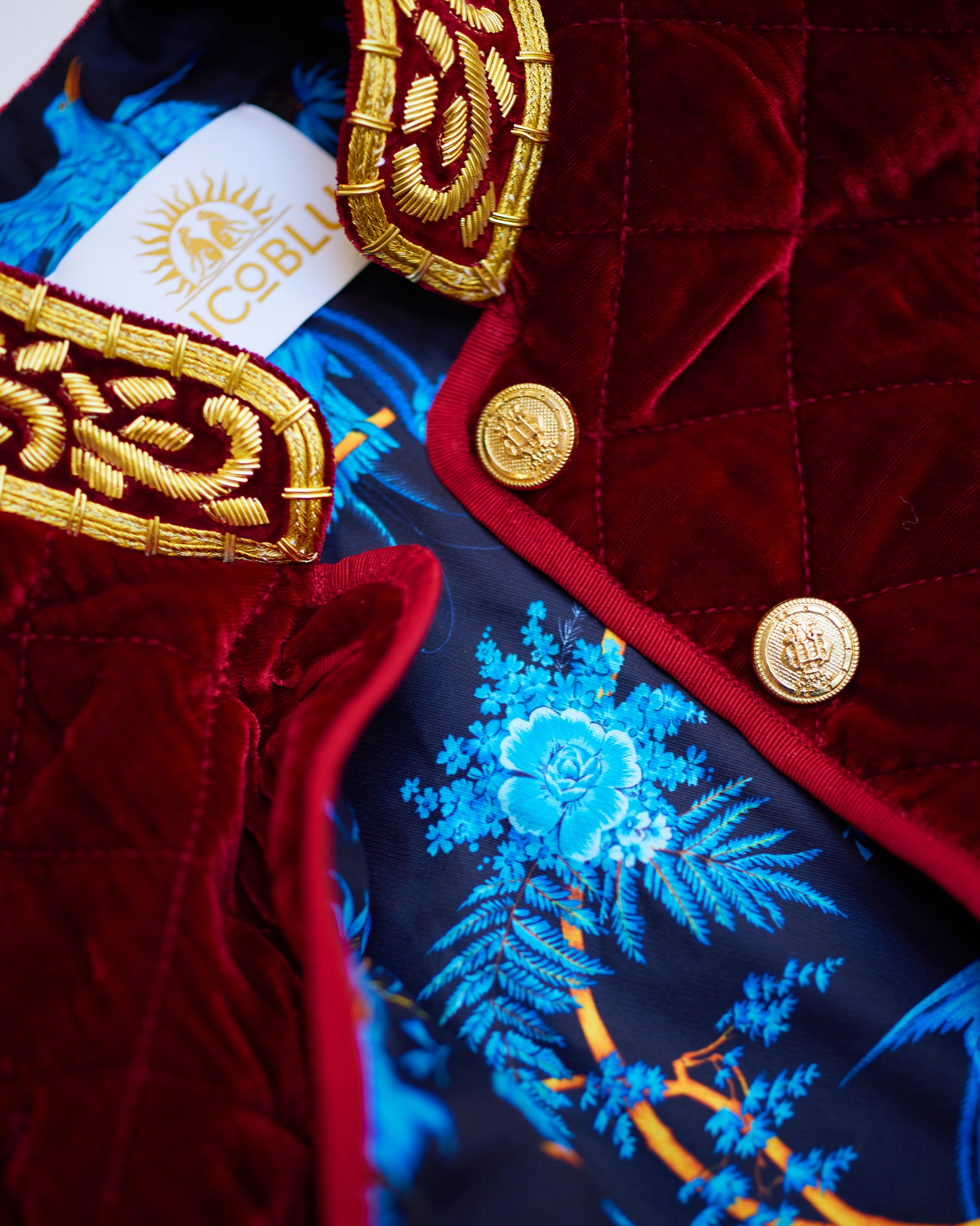 Embellishment detail and lining of the Bentley Quilted Vest in Crimson Red Silk Blend Velvet and Gold Embellishment
