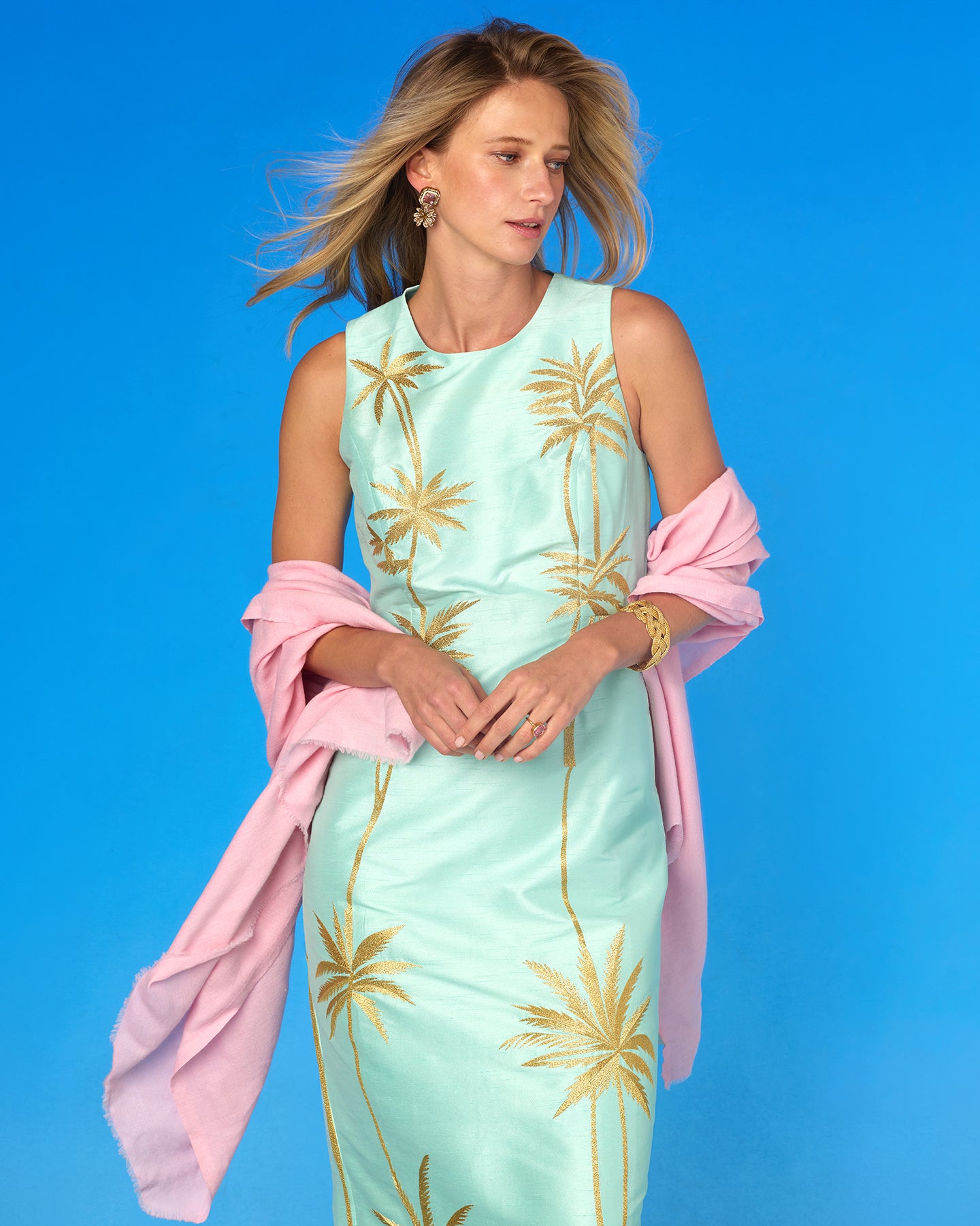 Woman wearing the Cosima Sash Belt in Sunset Lavender and the Josephine Pashmina Shawl in Blush Pink