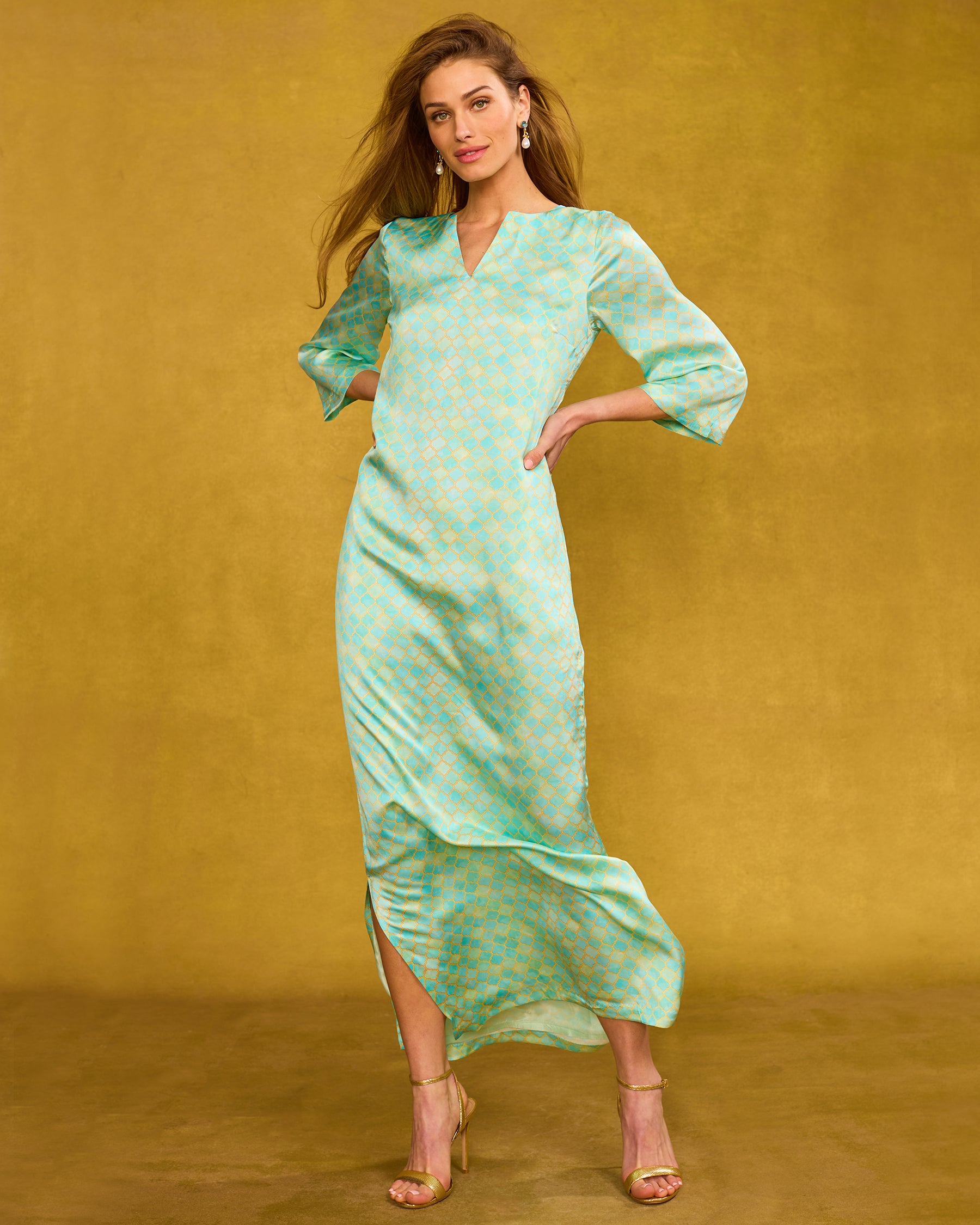 Majorelle Silk Dress in Mint Julep Alhambra hands on hips and wind blowing