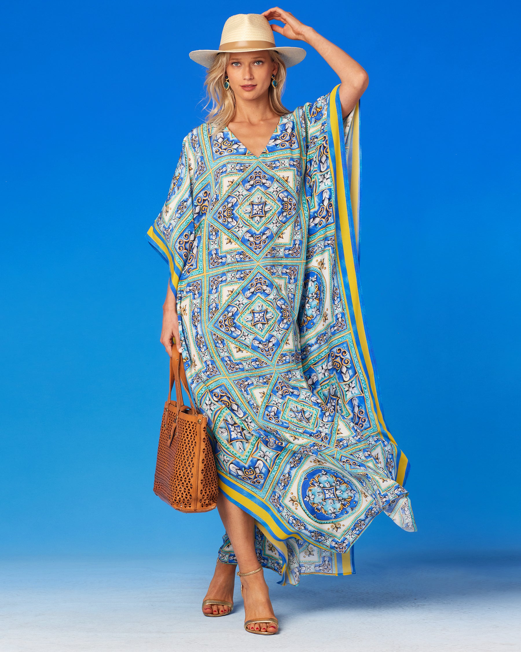 Marbella Silk Kaftan-Wearing Hat and Holding Tote Bag