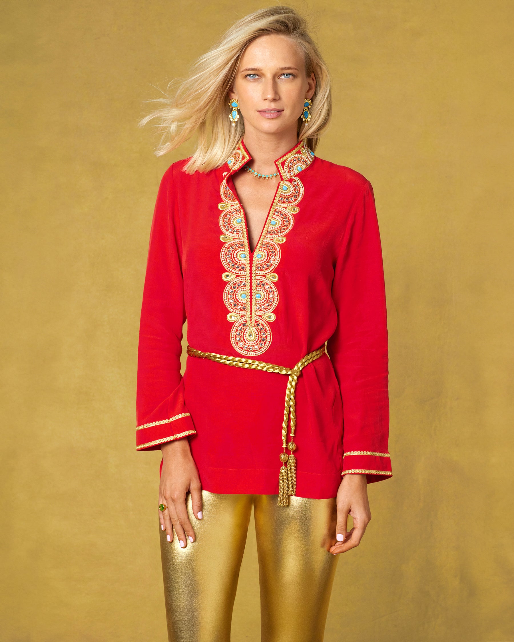 Noor Red Tunic with Gold Embellishment with the waist cinched by the gold rope Artemis Belt and paired with the Roxana Gold Leggings
