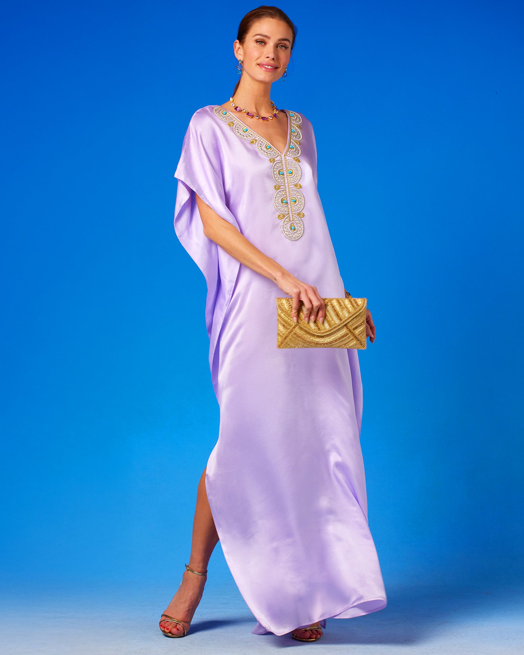 Betty Clutch in Beaded Gold worn with the Noor Silk Kaftan in Lavender