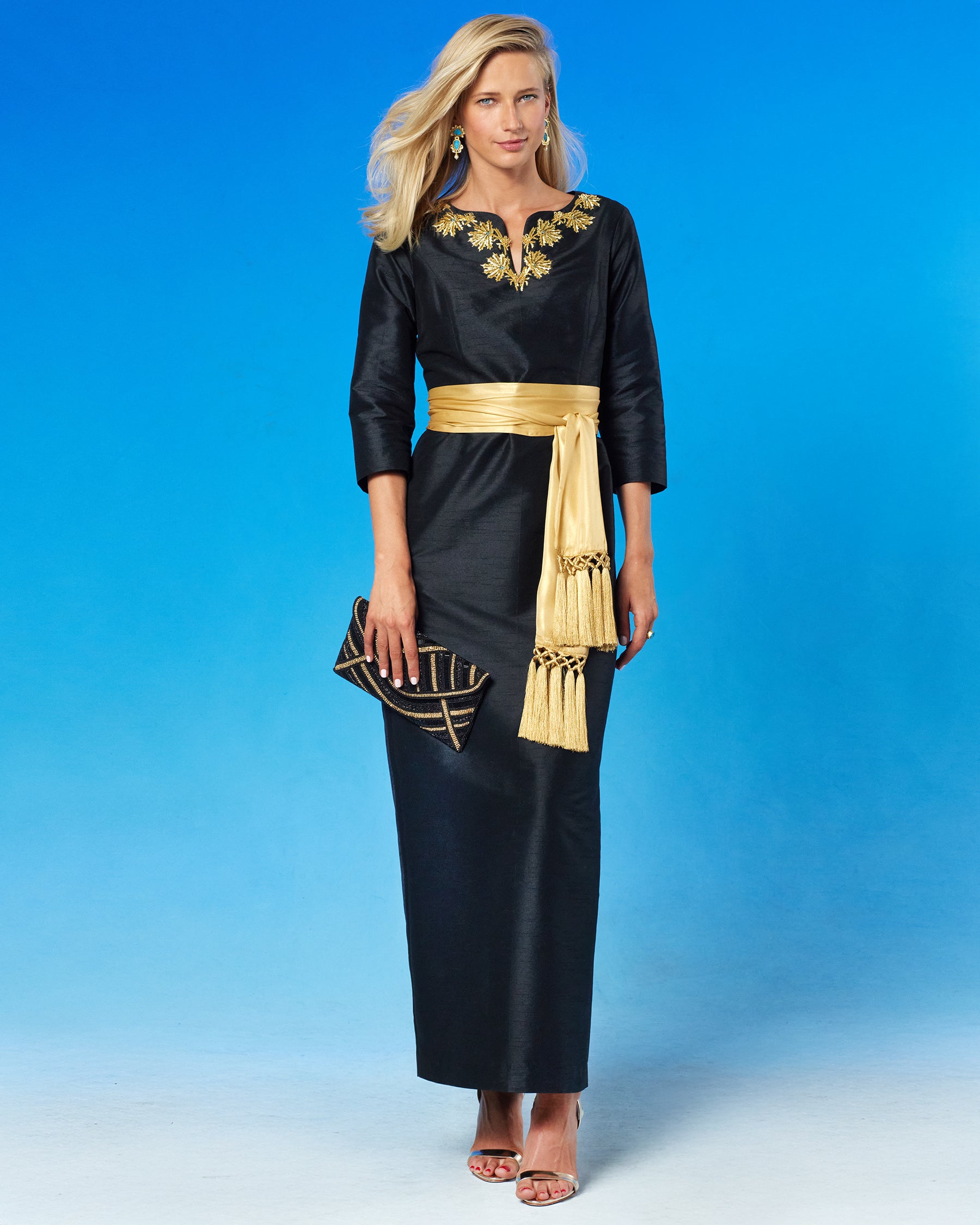 Octavia Long Dress in Black and Gold Palm Embellishment front view with waist cinched with the Cosima Sash Belt in Gold