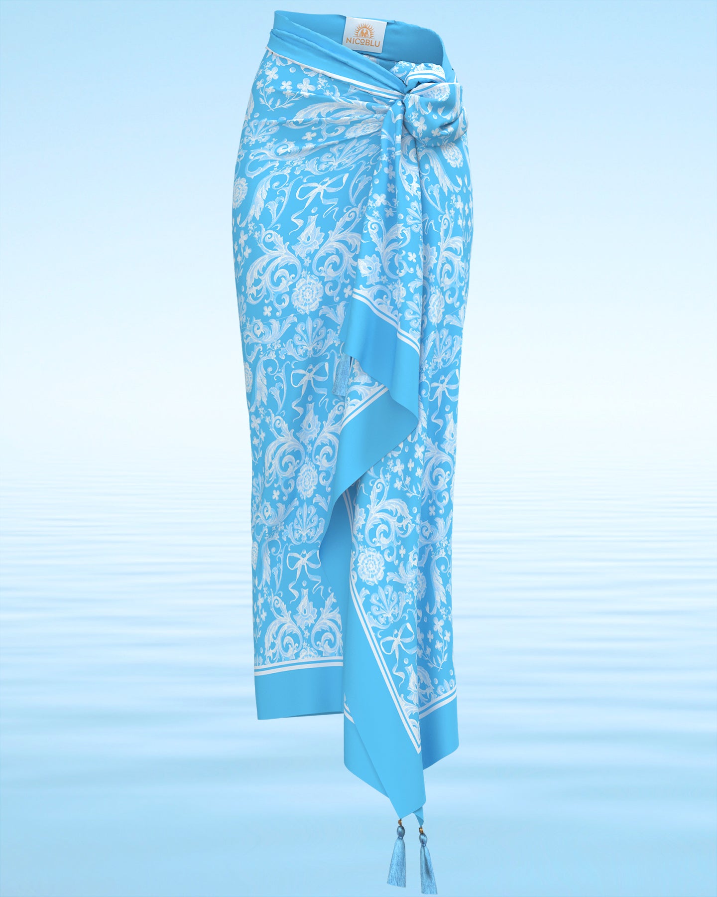Regency Porcelain Ribbons Organic Cotton Pareo shown from the front and tied as a skirt