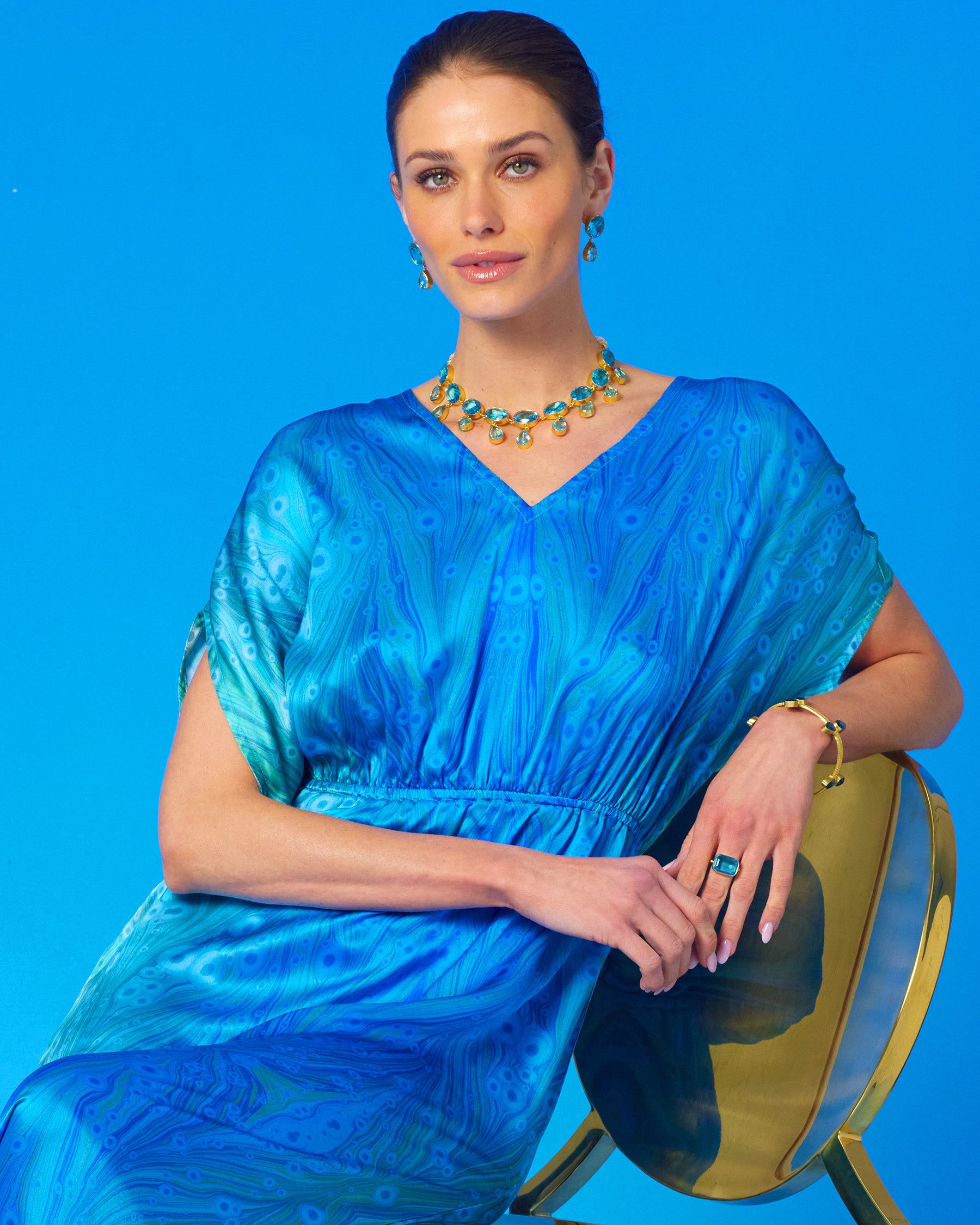 Regency Statement Ring in Crystal Blue worn with the Calliope Silk Dress