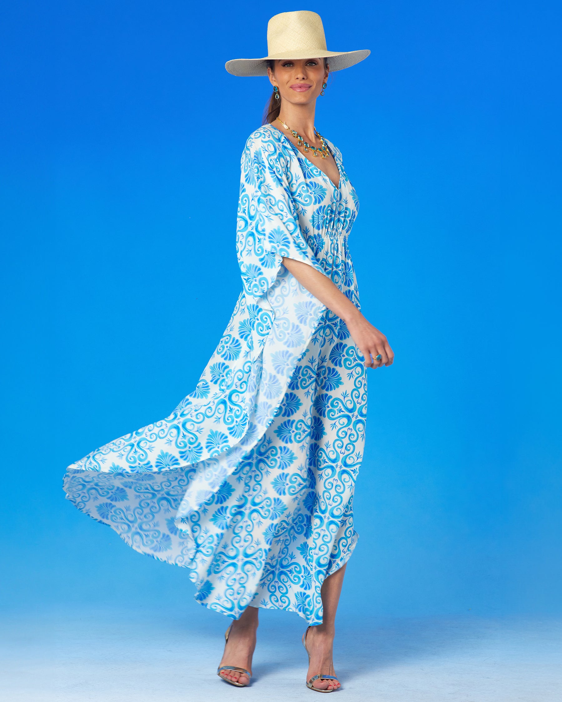 Thetis Cinched Long Kaftan in Blue and White-woman twirling