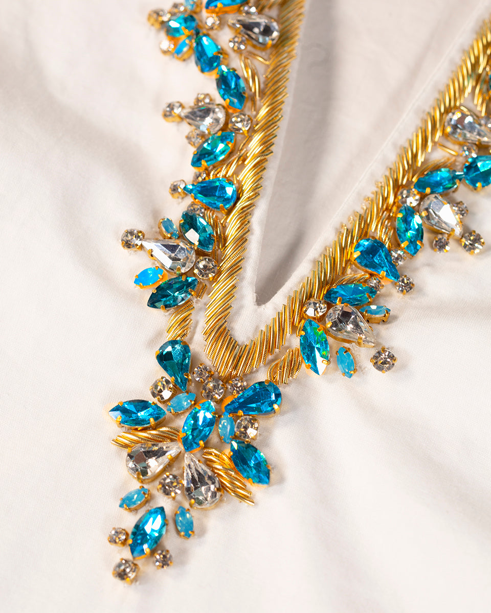 embelished tunic with blue crystals and gold