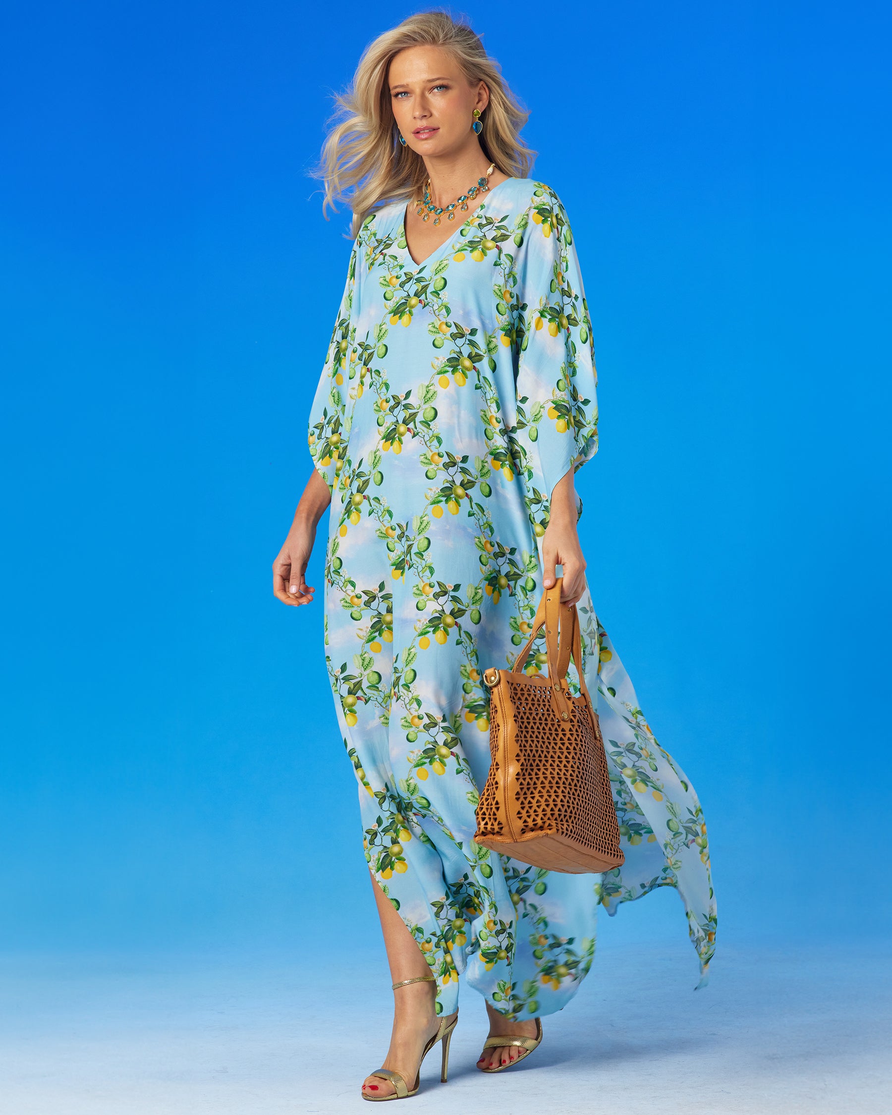 Annabelle Kaftan in French Citrus Trellis worn with a leather tote bag-side view