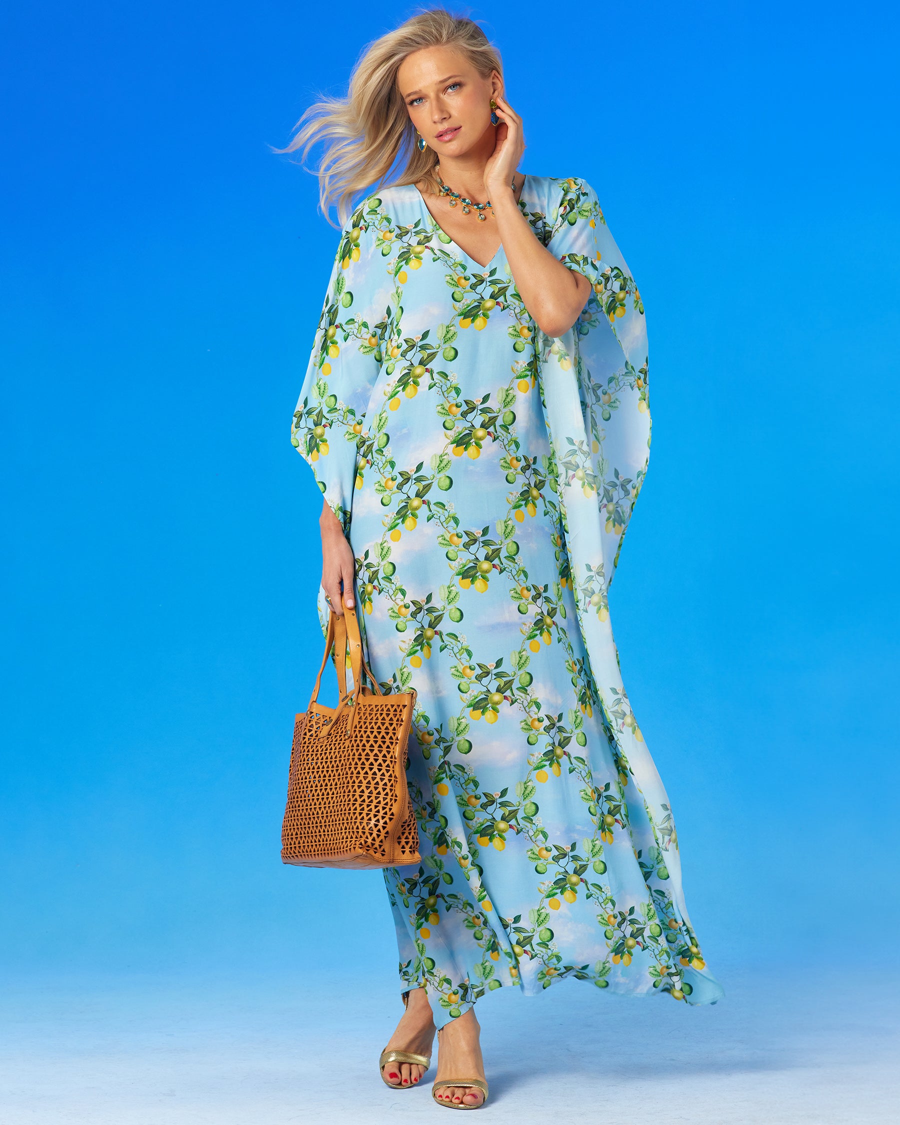 Annabelle Kaftan in French Citrus Trellis worn with a leather tote bag-side view