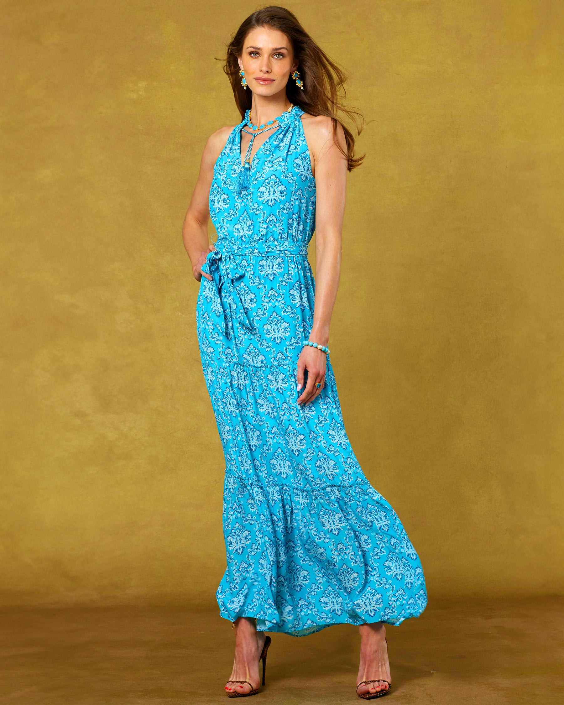 Bailey Halterneck Maxi Dress in Turquoise Baroque Florals front view with wind blowing the skirt