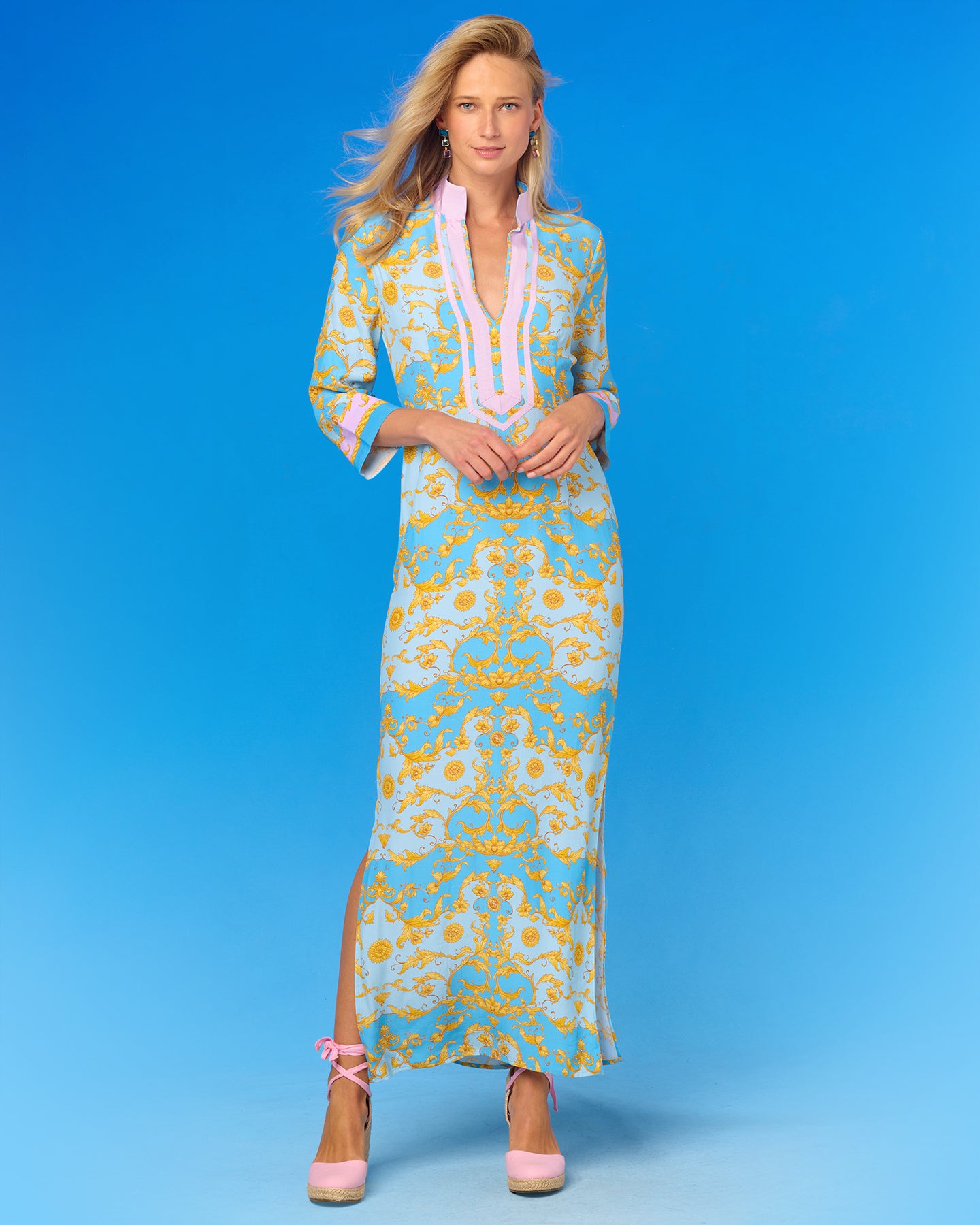 Woman wearing a floral dress against a blue background