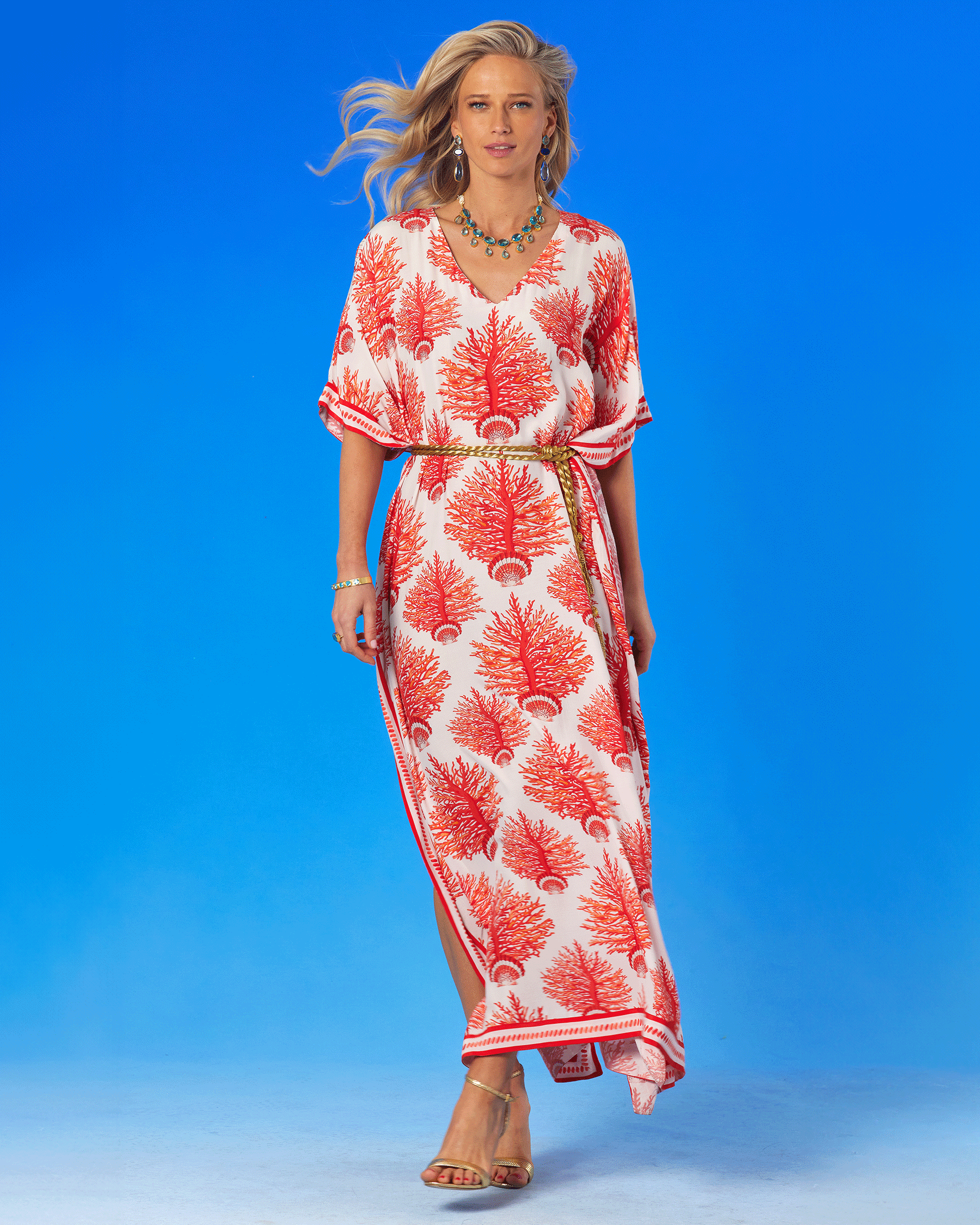 Carolina Kaftan in Red Coral and Seashell Motif with the waist cinched with a gold rope belt-full frontal view
