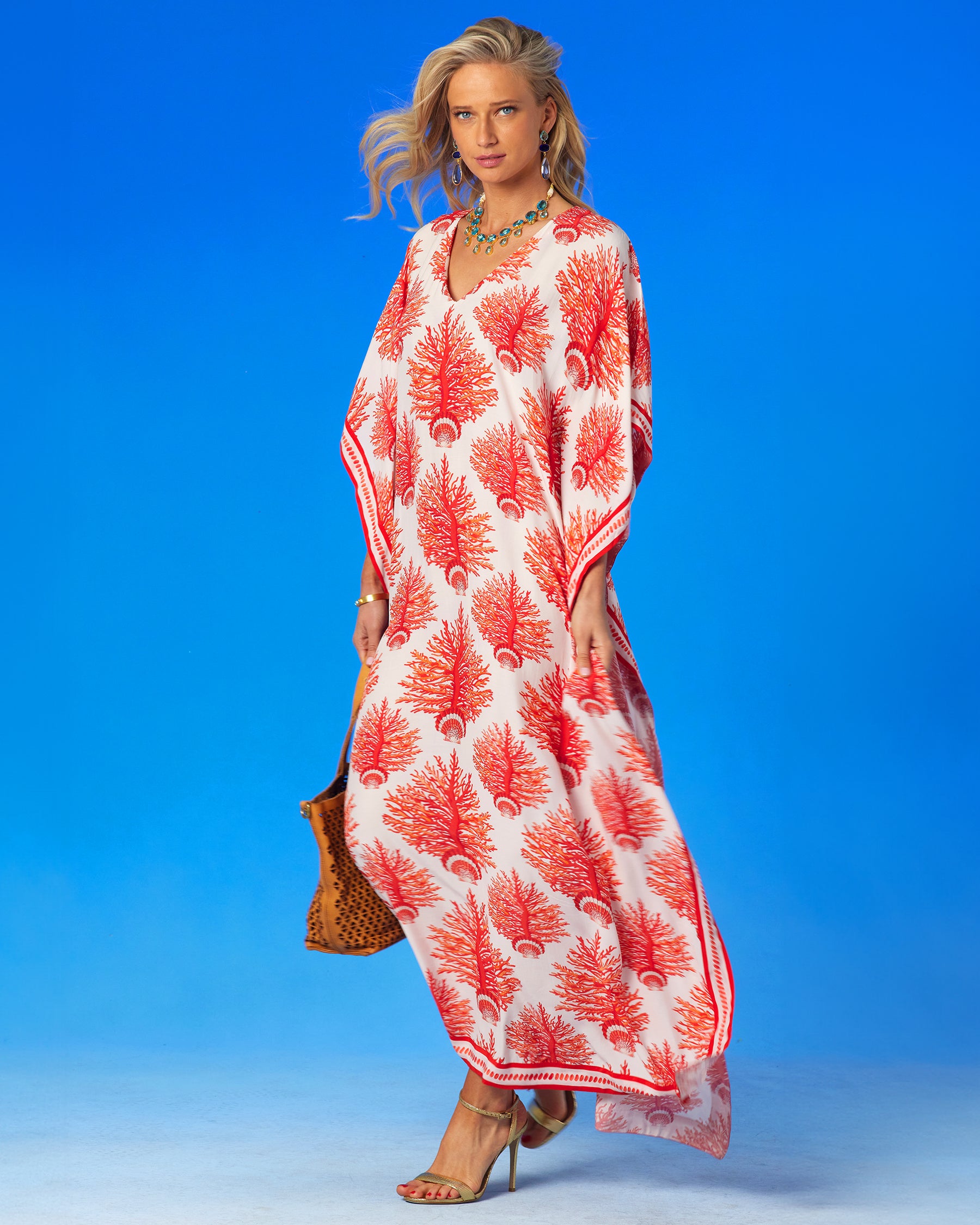 Carolina Kaftan in Red Coral and Seashell Motif with a leather tote bag