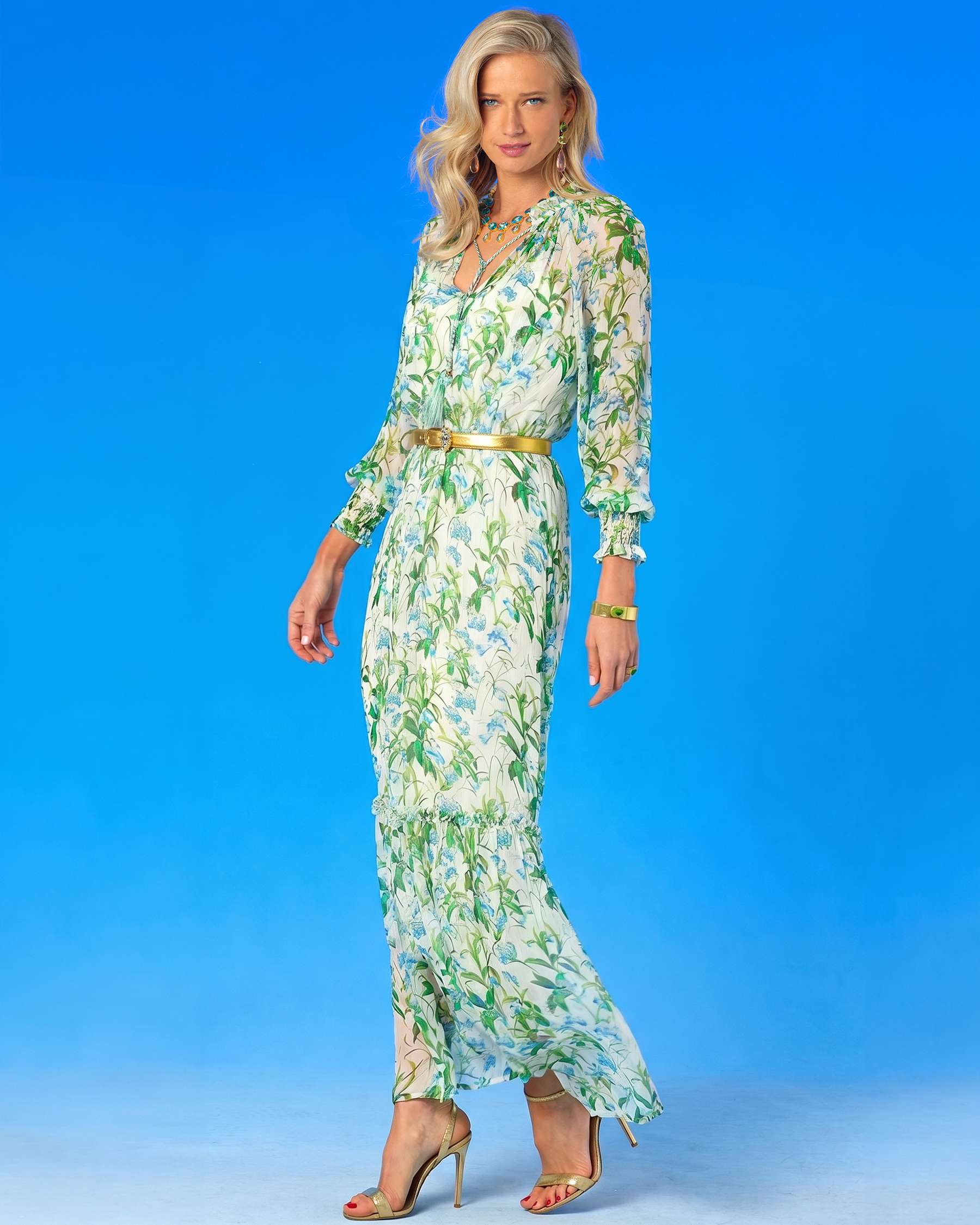Woman wearing a floral dress against a blue background