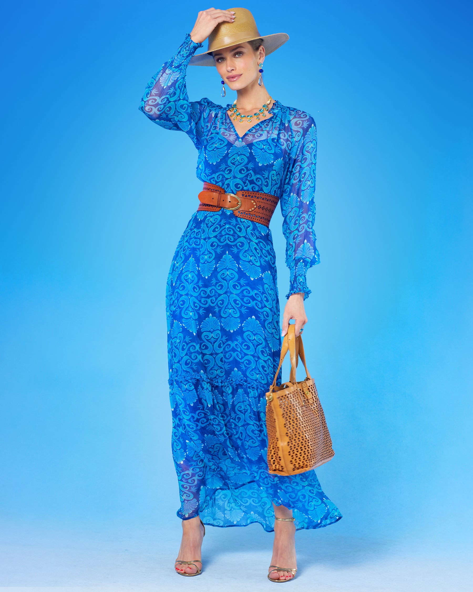 Campomaggi Malibu Pyramid Cut Tote Bag in Tan worn with the Celine Maxi Crinkle Chiffon Dress in Blue Mediterranean Swirl