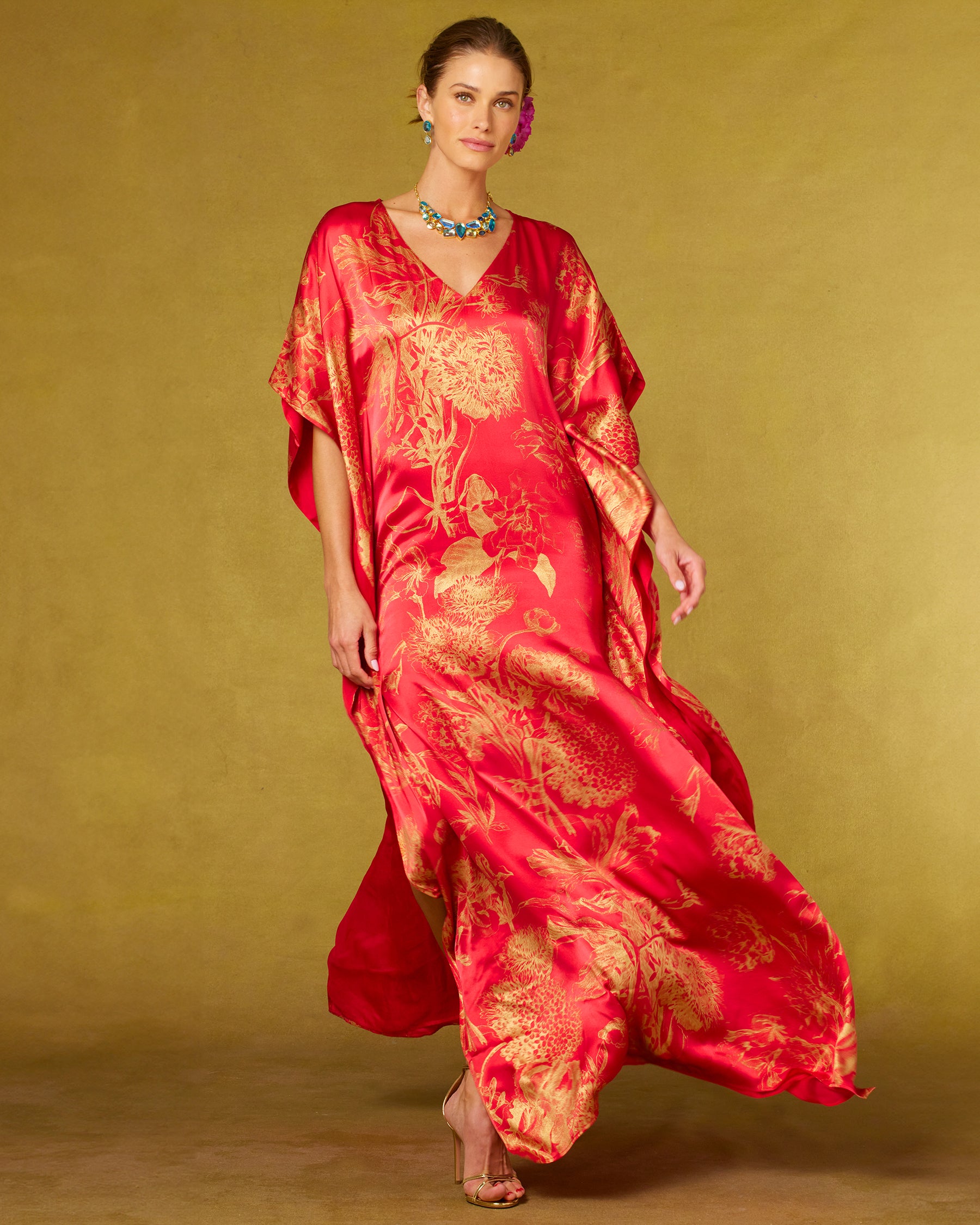 Chantal Red Silk Kaftan in Gold Floral Toile-Front view with kaftan blowing in the wind