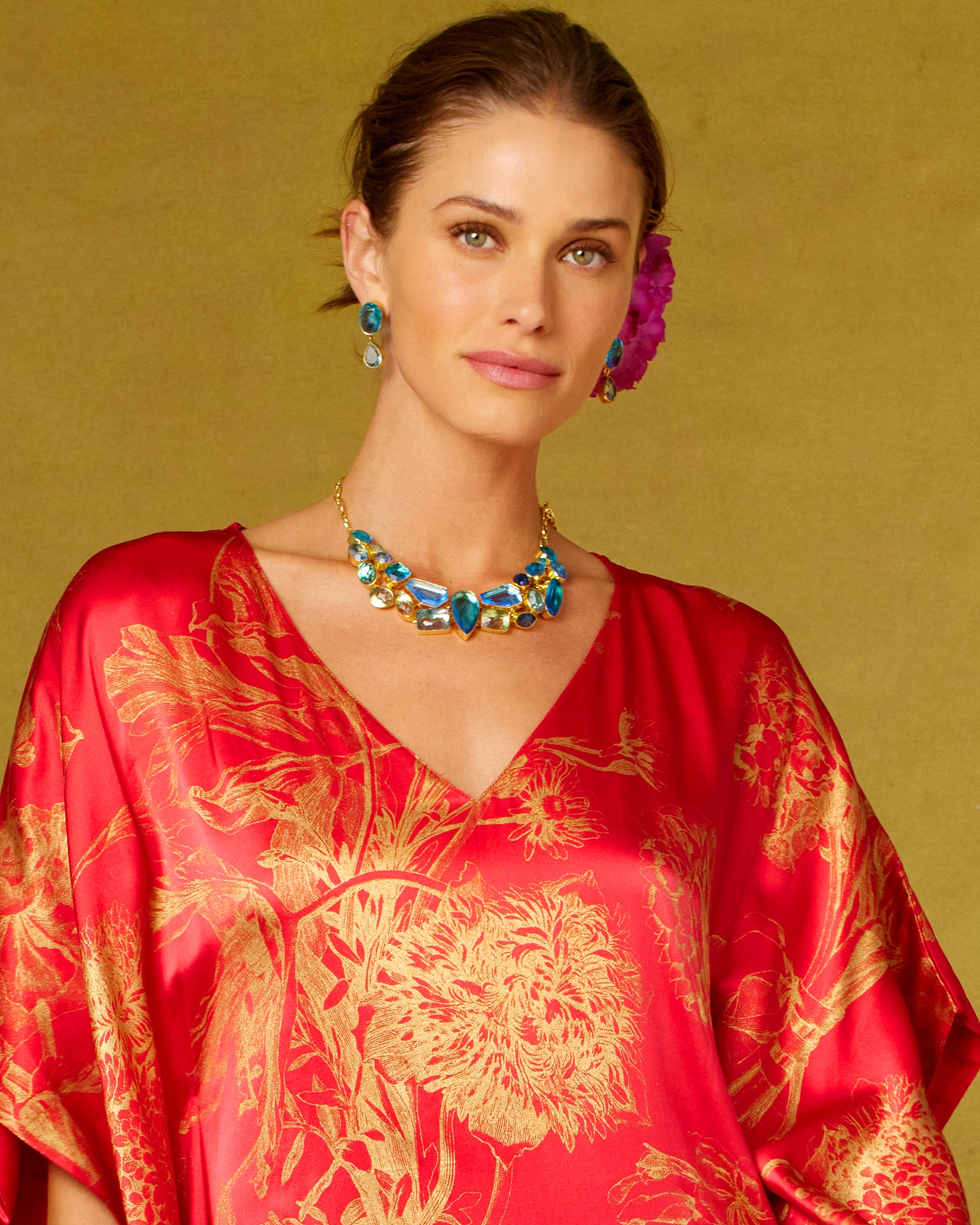 Constance Jewel Encrusted Necklace in Byzantine Sea Blues worn with the Chantal Red Silk Kaftan in Gold Floral Toile