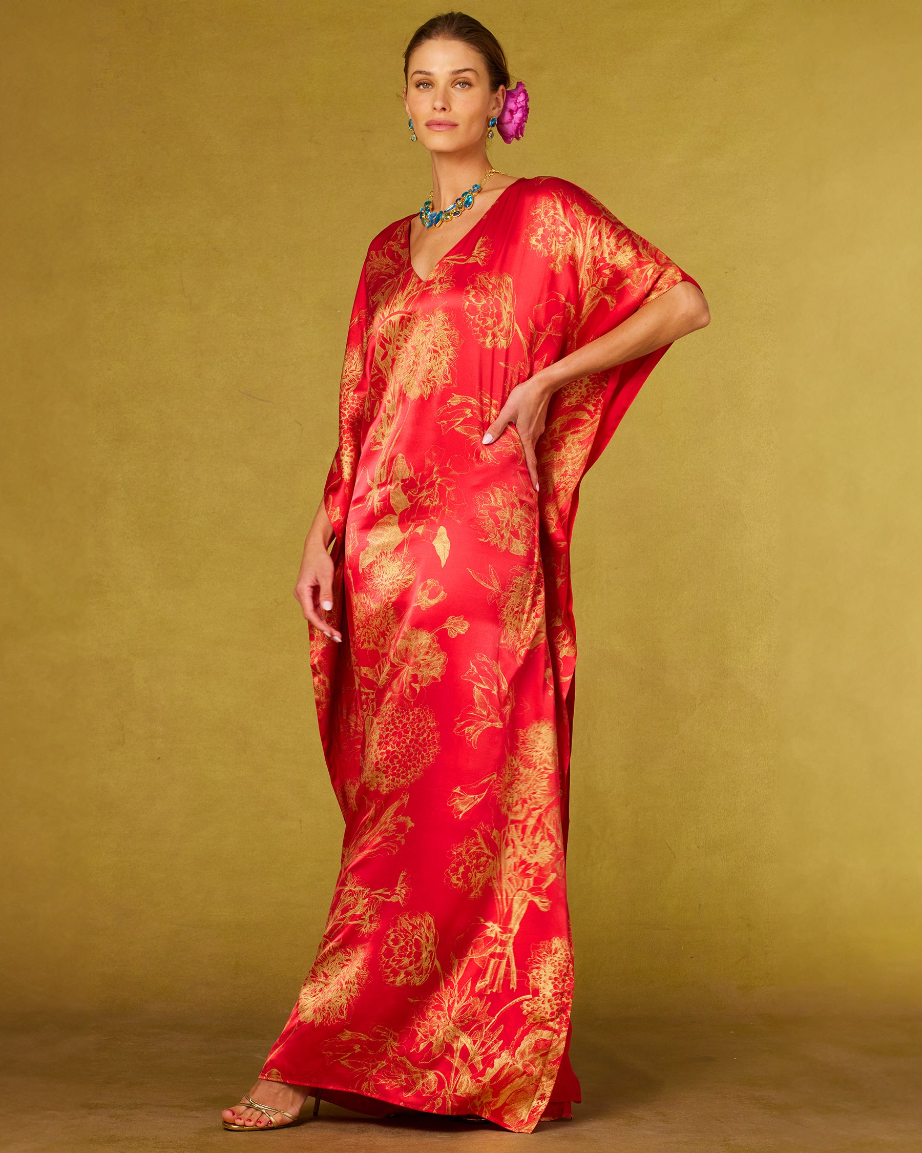 Chantal Red Silk Kaftan in Gold Floral Toile and hand on hip