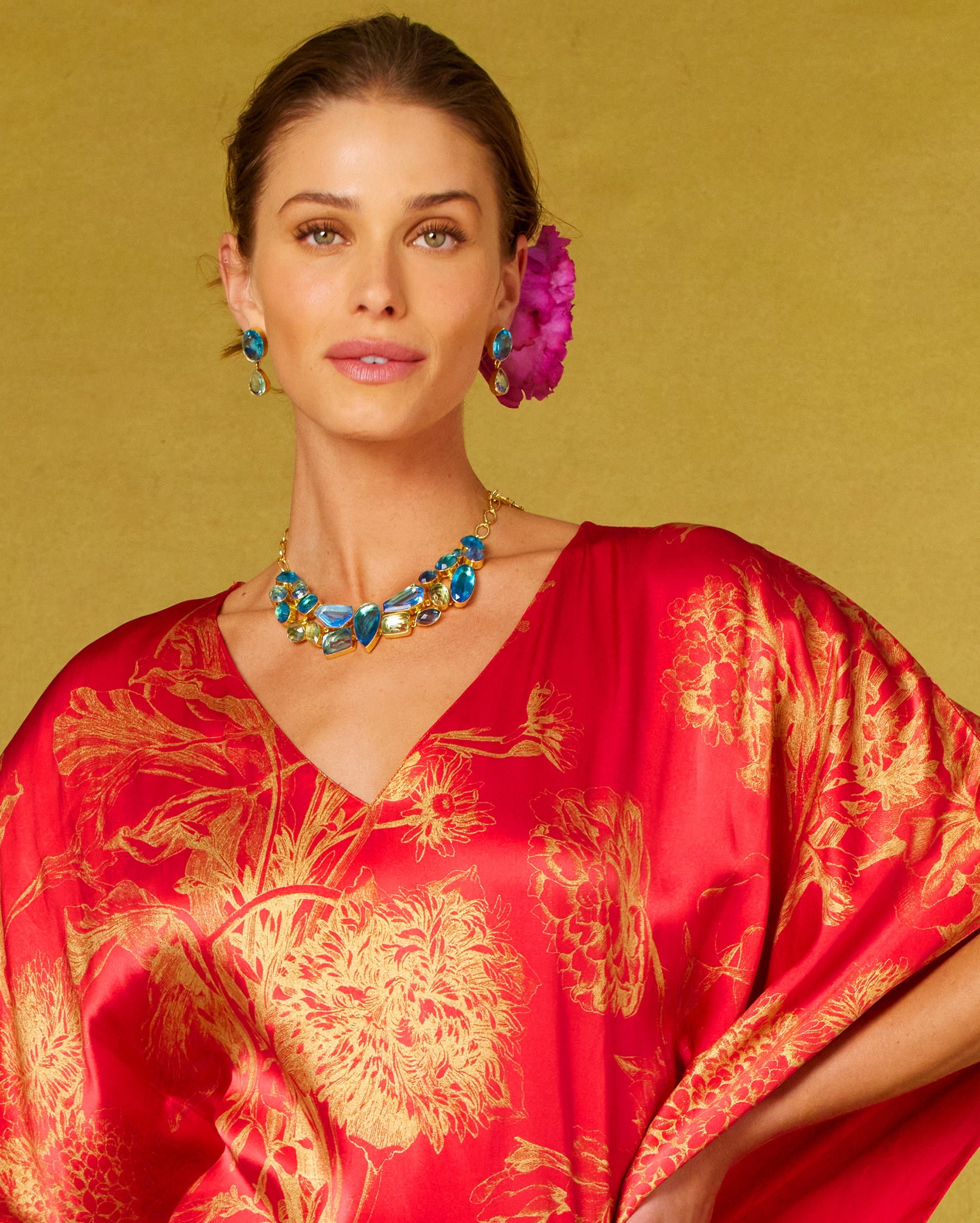 Constance Jewel Encrusted Necklace in Byzantine Sea Blues worn with the Chantal Red Silk Kaftan in Gold Floral Toile