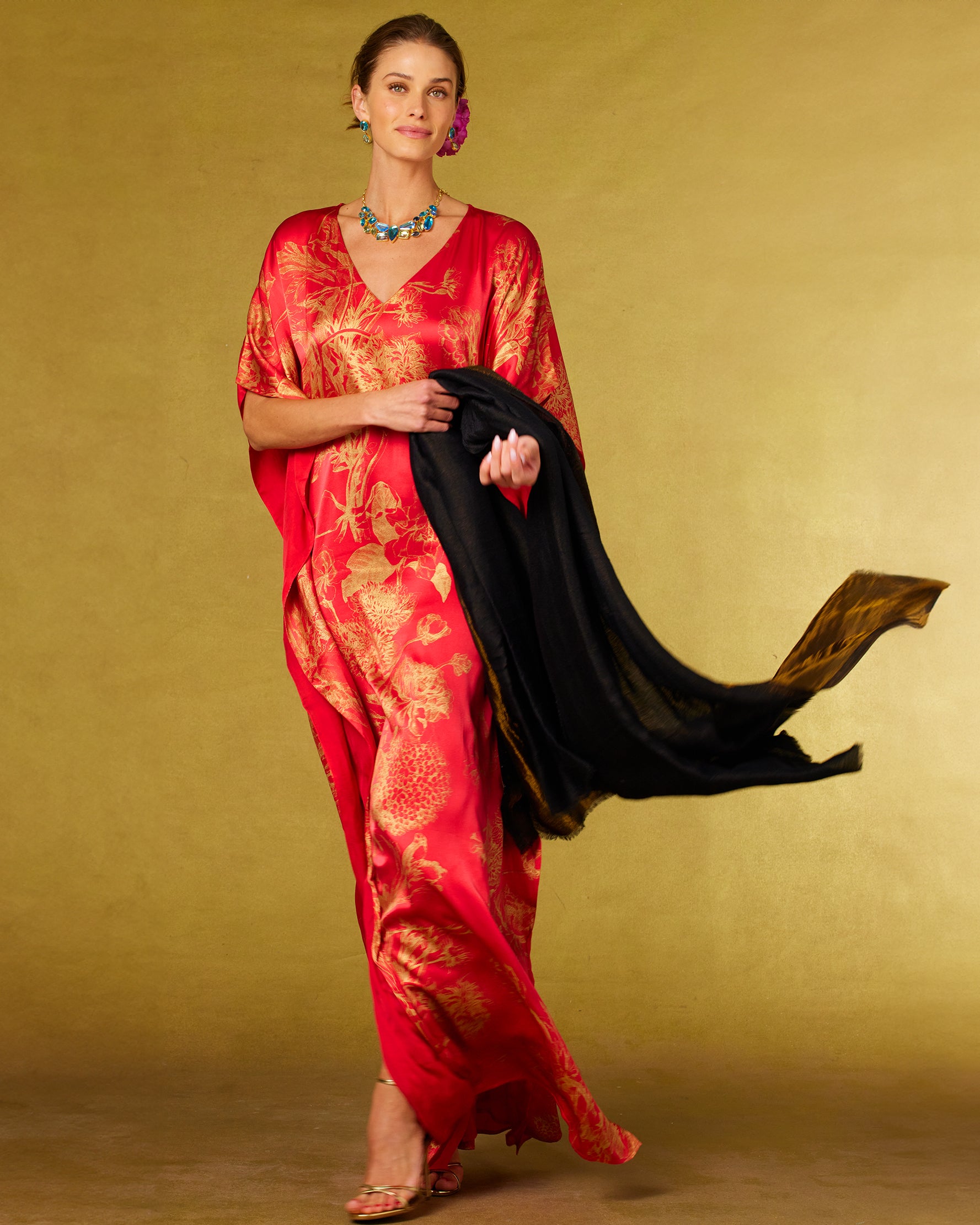 Chantal Red Silk Kaftan in Gold Floral Toile-and Josephine Pashmina Shawl in Black and Bronze in hand