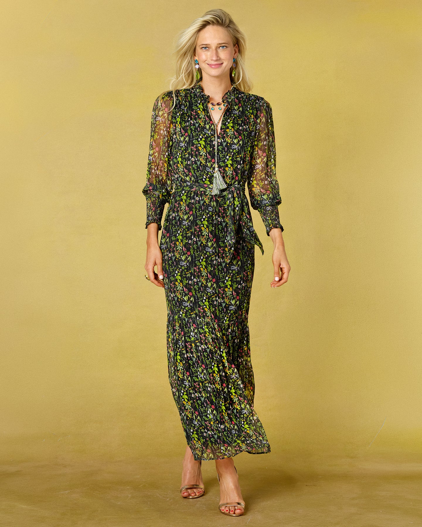 Woman wearing a floral dress against a yellow background