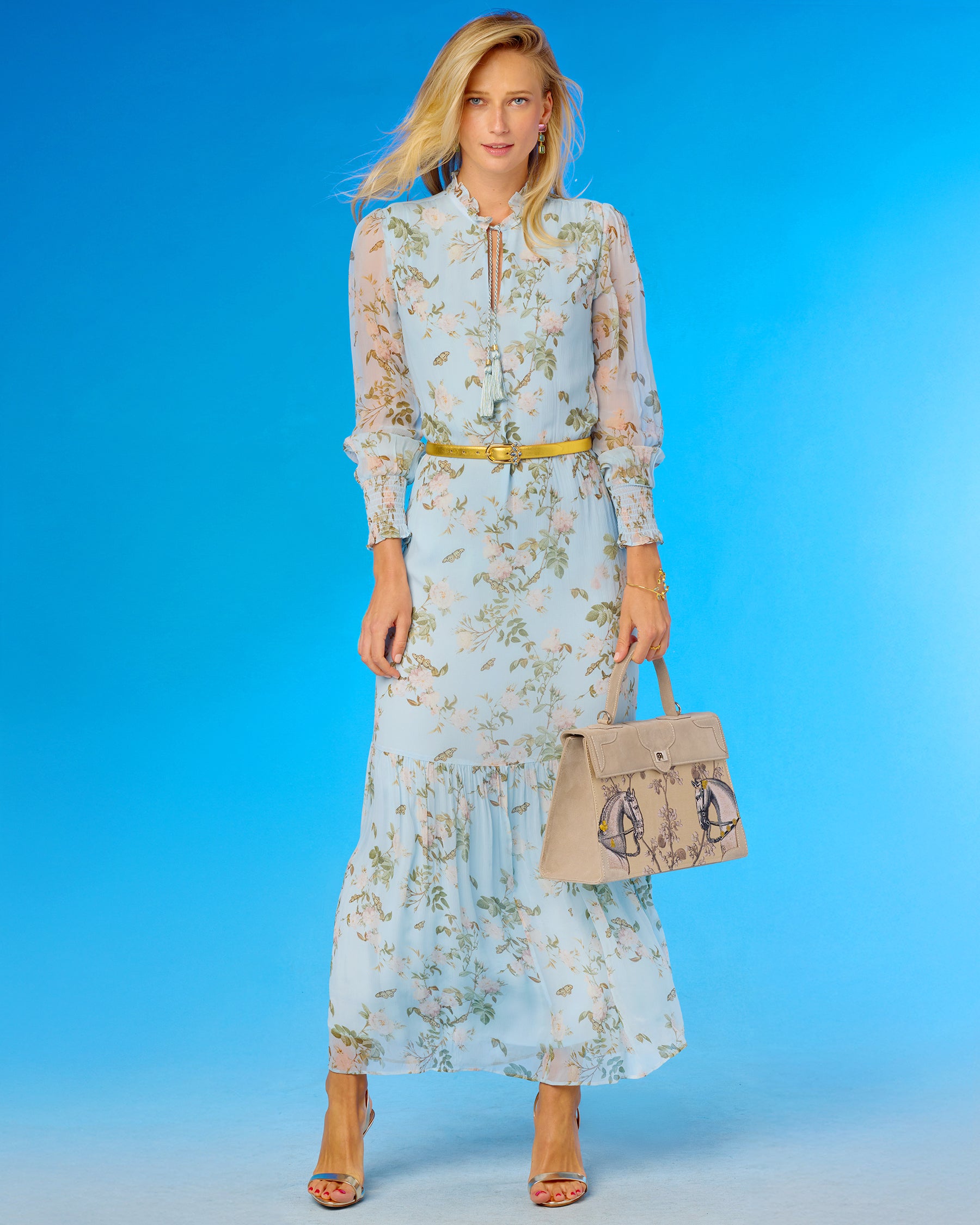 Marquise Paris Recontre Équestre Top Handle Shoulder Bag in Sand worn with the Colette Maxi Chiffon Dress in Porcelain Sky English Garden