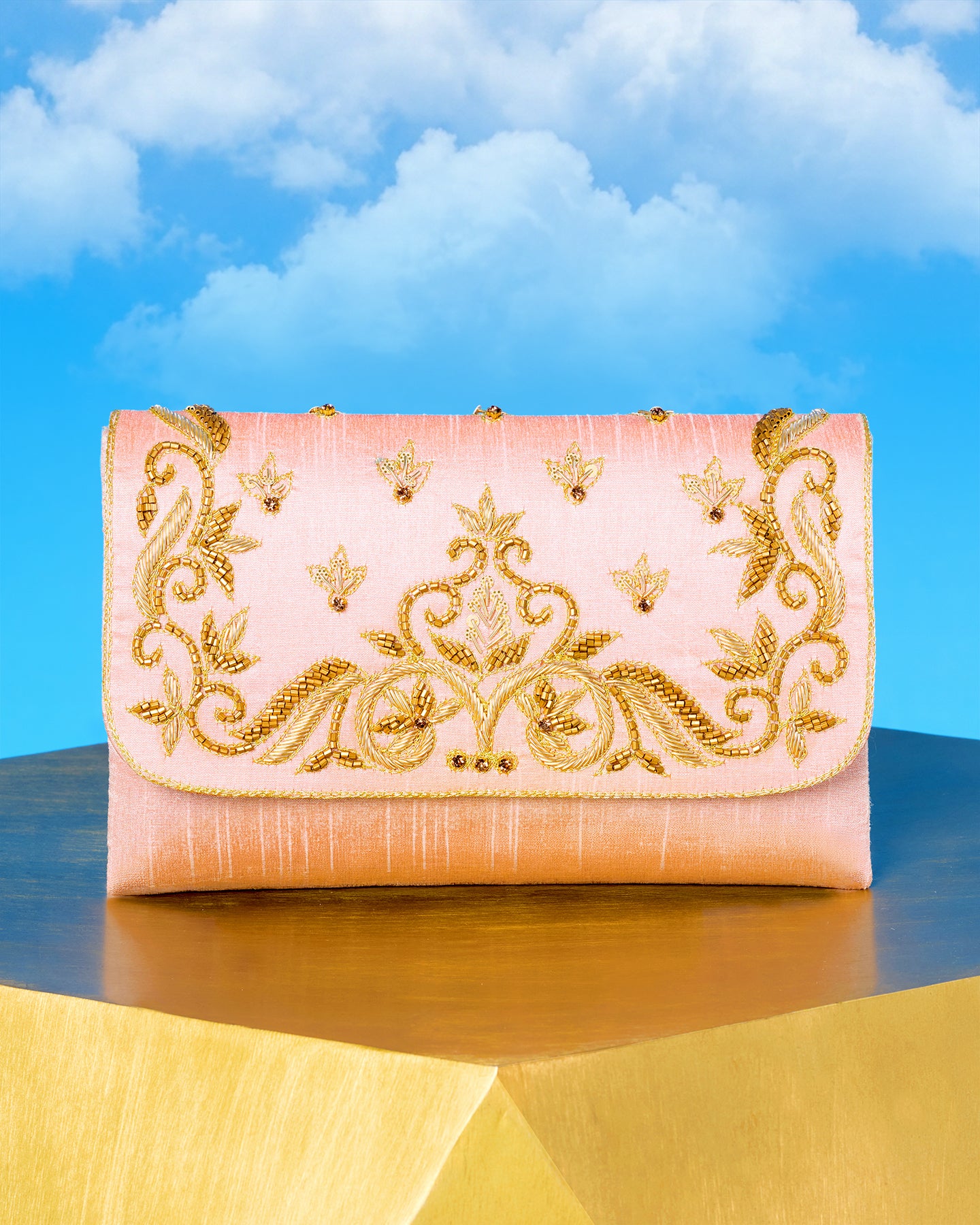 The Corelia Clutch in Blush Pink and Gold Embellishment front view