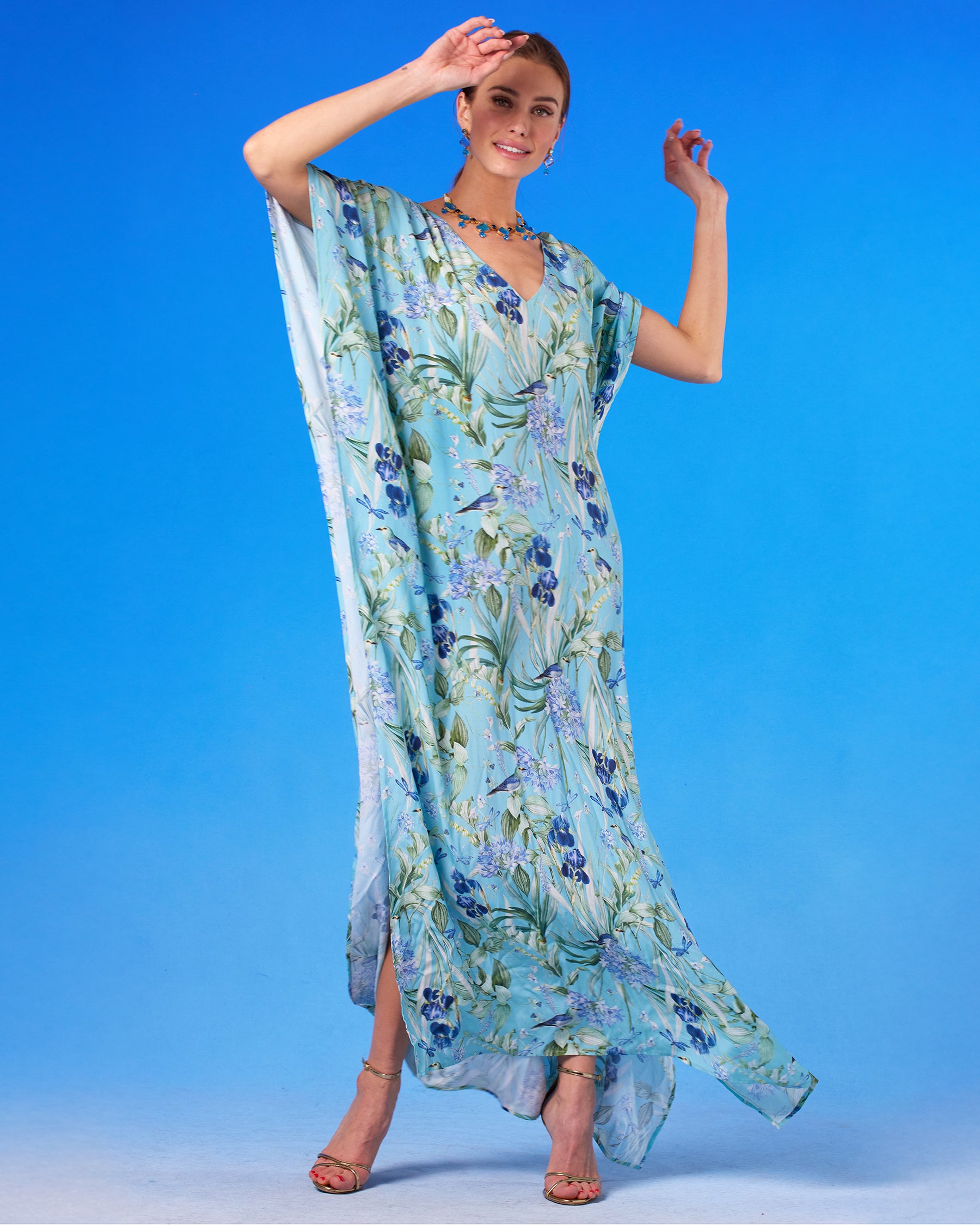 Evelyn Kaftan in Magical Garden with hands up in the air