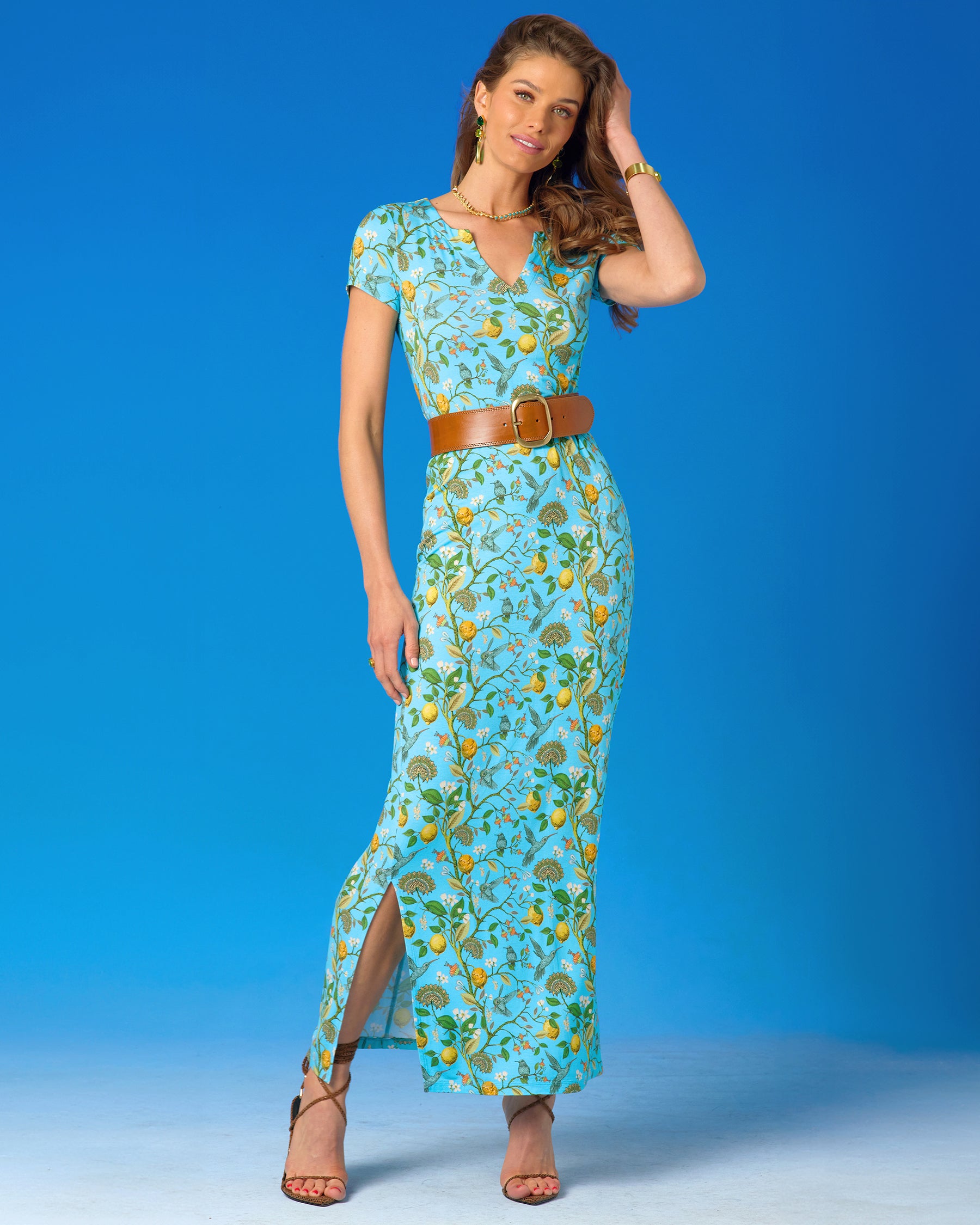 Flora Long Stretch Dress in Turquoise Hummingbird Print with the waist cinched by the Cassidy Belt