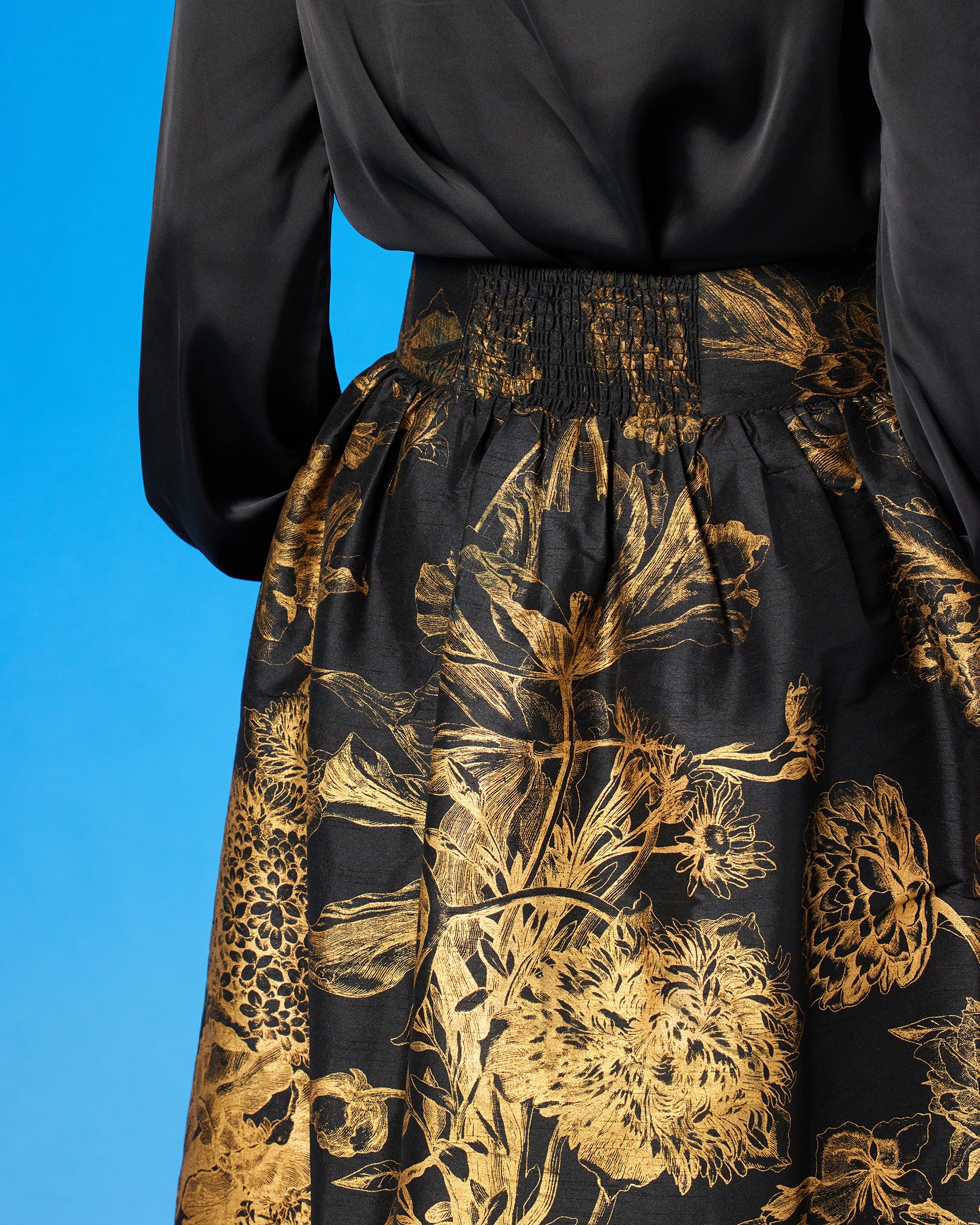 Florence Long Full Skirt in Black and Gold Floral Toile and the Anastasia Blouse-Back view detail with elasticized backside