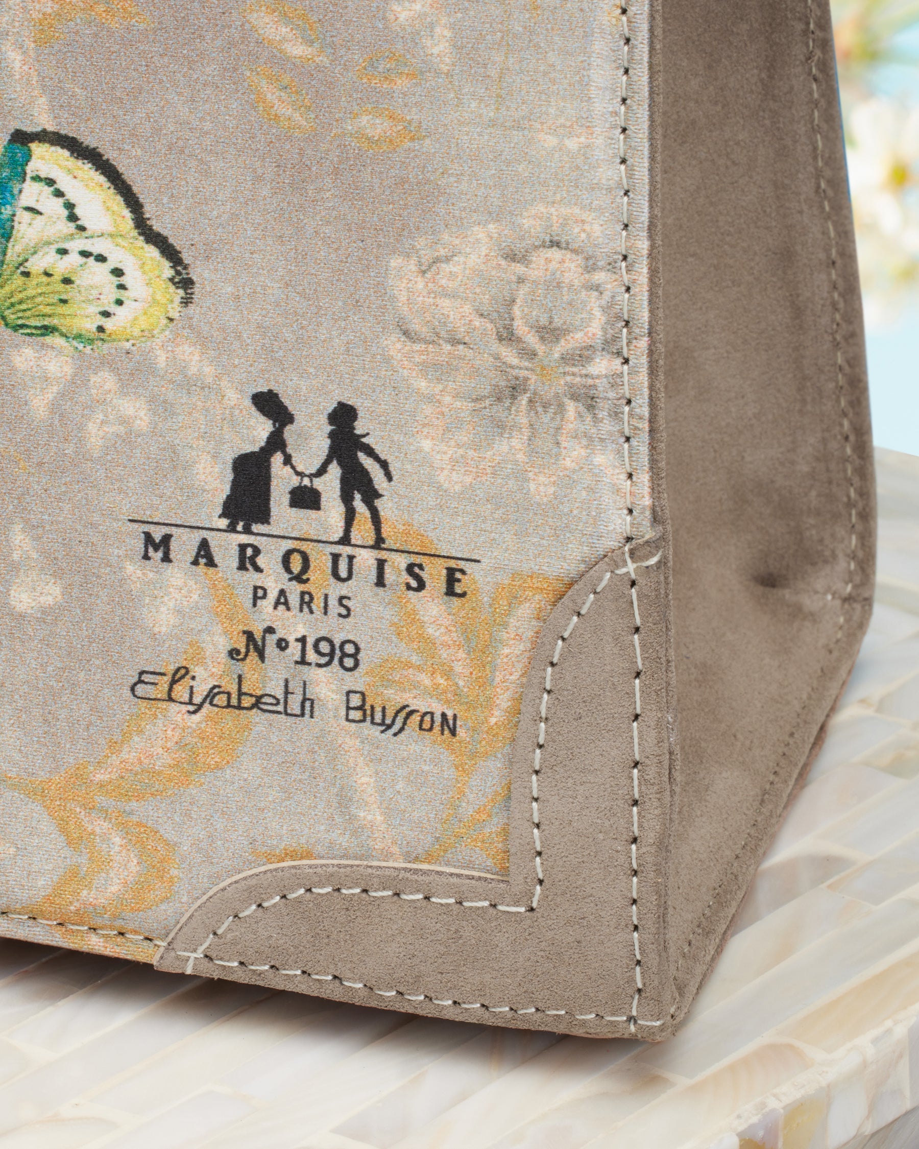 Marquise Paris Marquise Le Perdreau Top Handle Shoulder Bag in Sand-Closeup of logo
