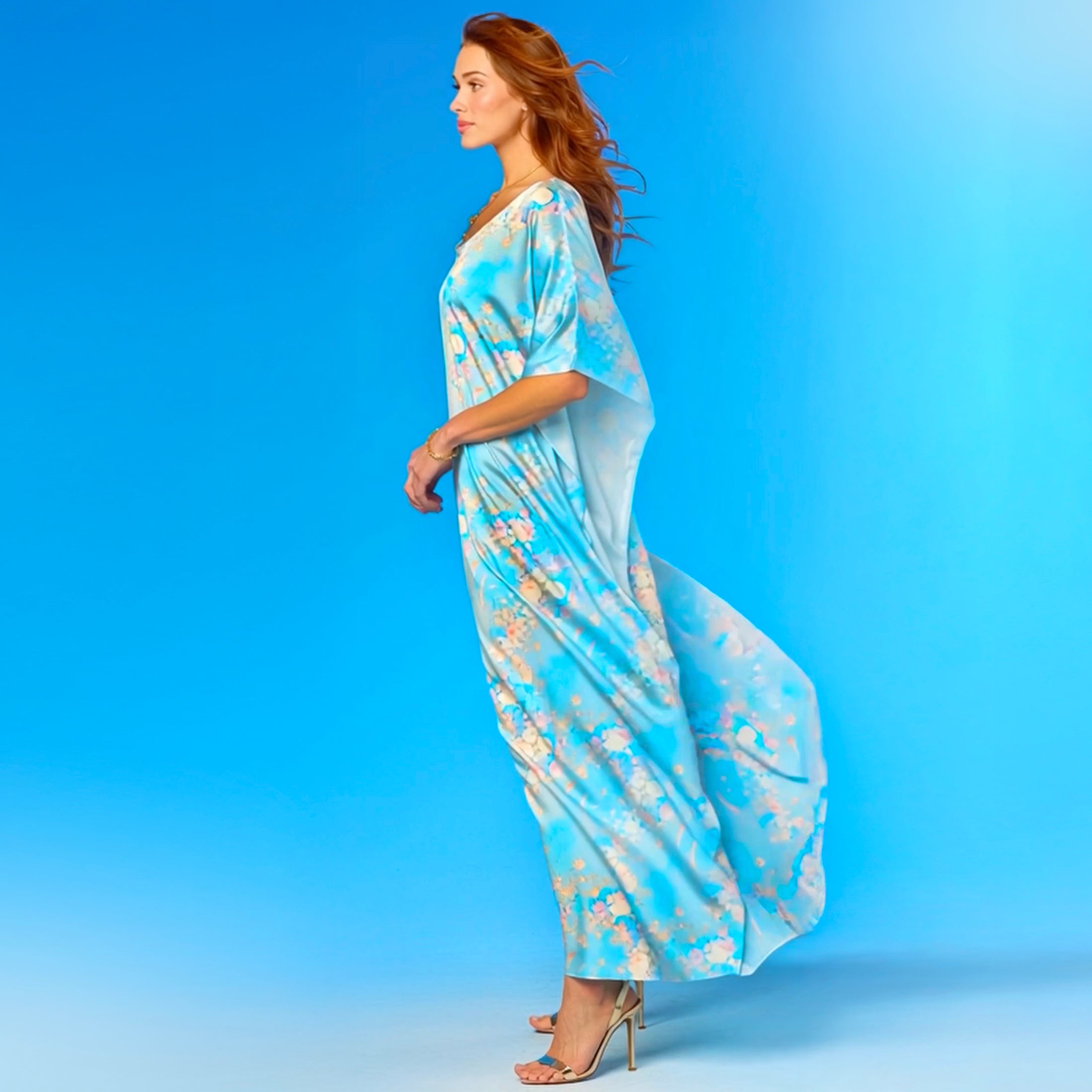 Woman wearing a blue floral dress against a blue background