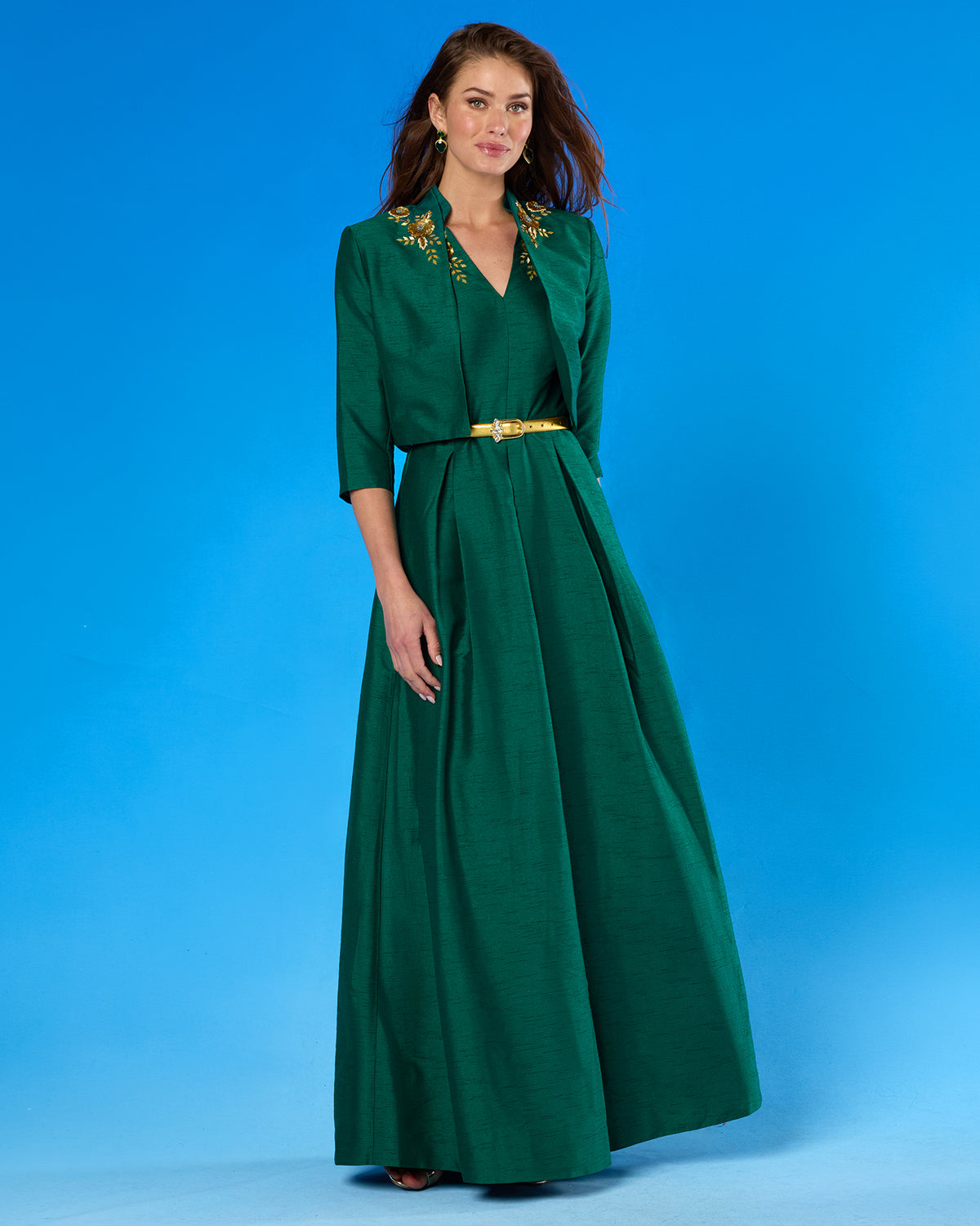The Esmeralda Bolero Jacket in Emerald Green and Gold Floral Embellishment paired with the Isabella Cap-Sleeve Gown in Emerald Green