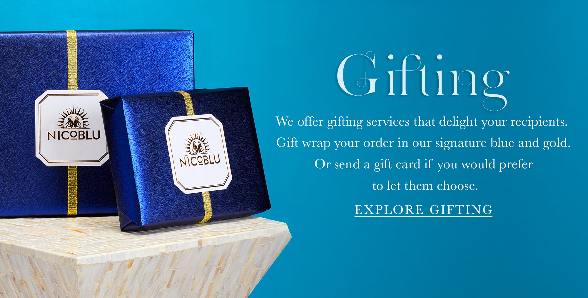 Gift boxes wrapped in NicoBlu signature blue and gold.