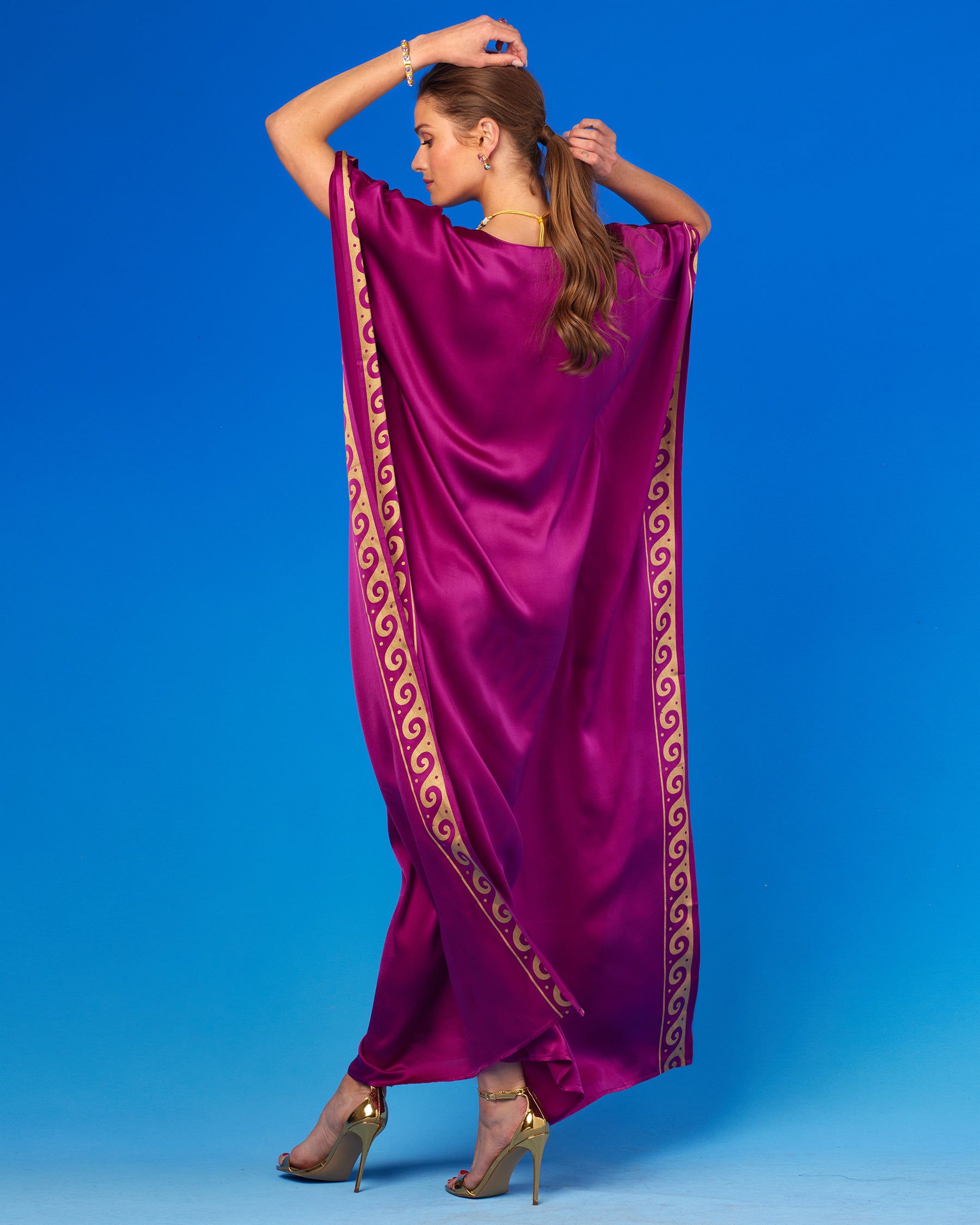 Minerva Silk Kaftan in Tyrian Purple and Gold-Back View with Arms Up