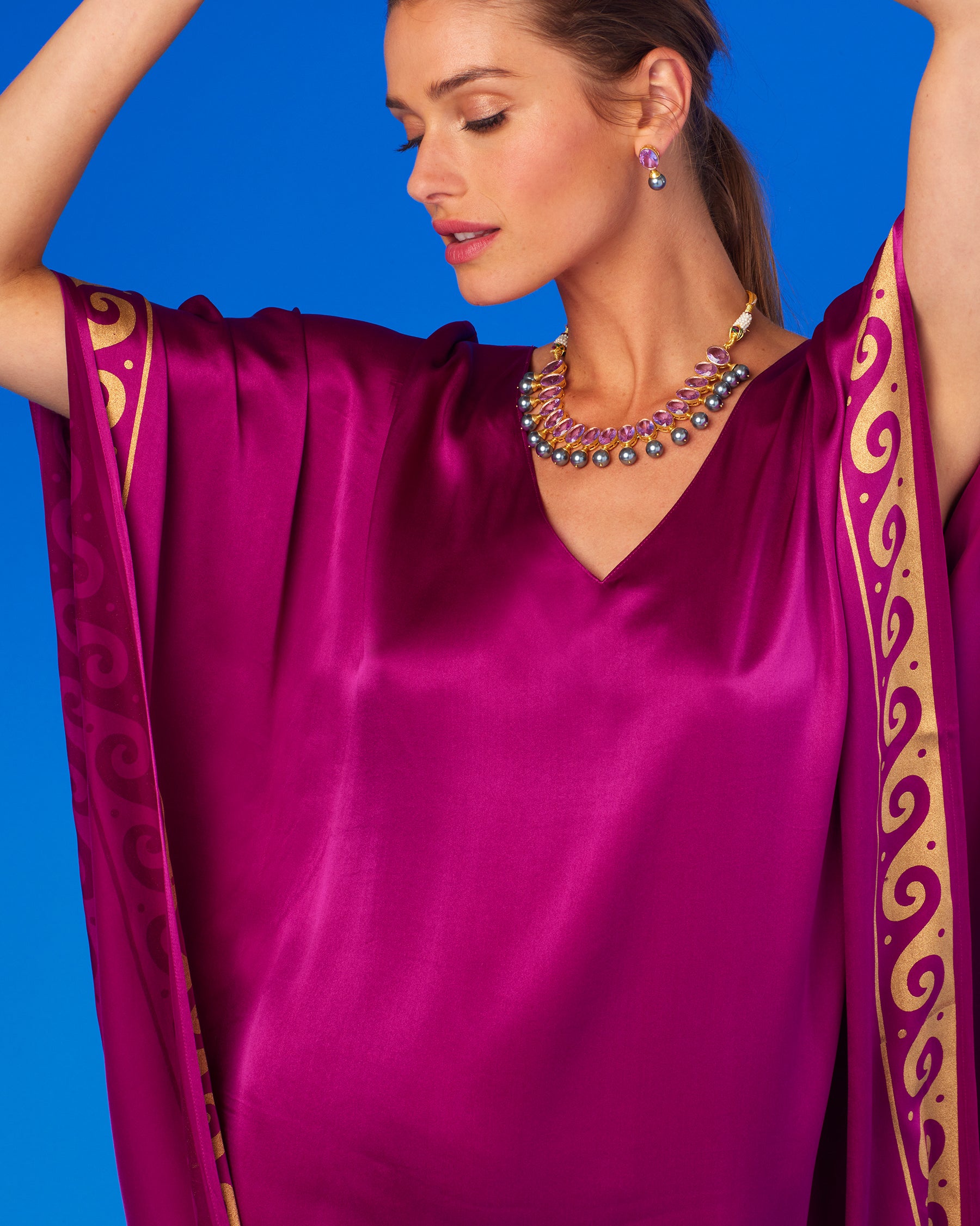 Minerva Silk Kaftan in Tyrian Purple and Gold-Portrait with Arms Up