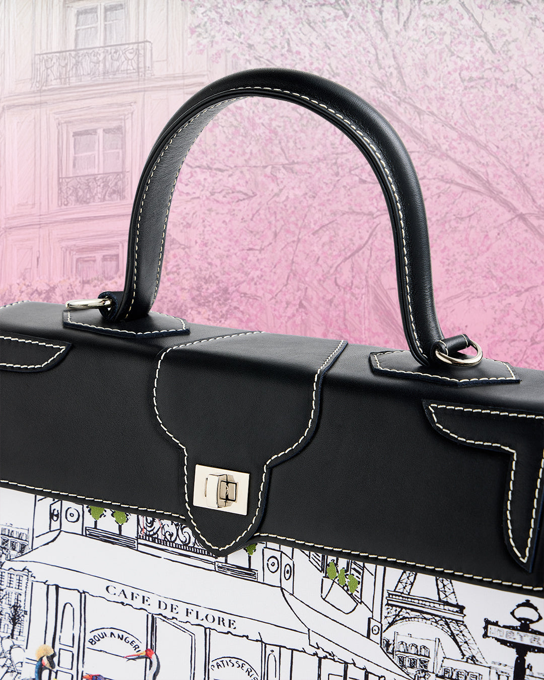 Closeup view showcasing white stitching on leather of the Marquise Paris Café de Flore Top Handle Shoulder Bag