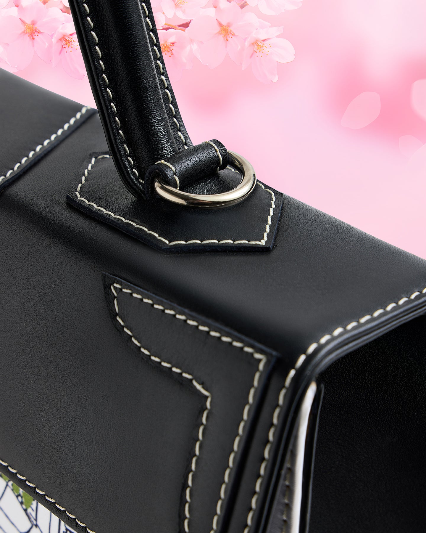 Closeup view of the stitching on leather of the Marquise Paris Café de Flore Top Handle Shoulder Bag